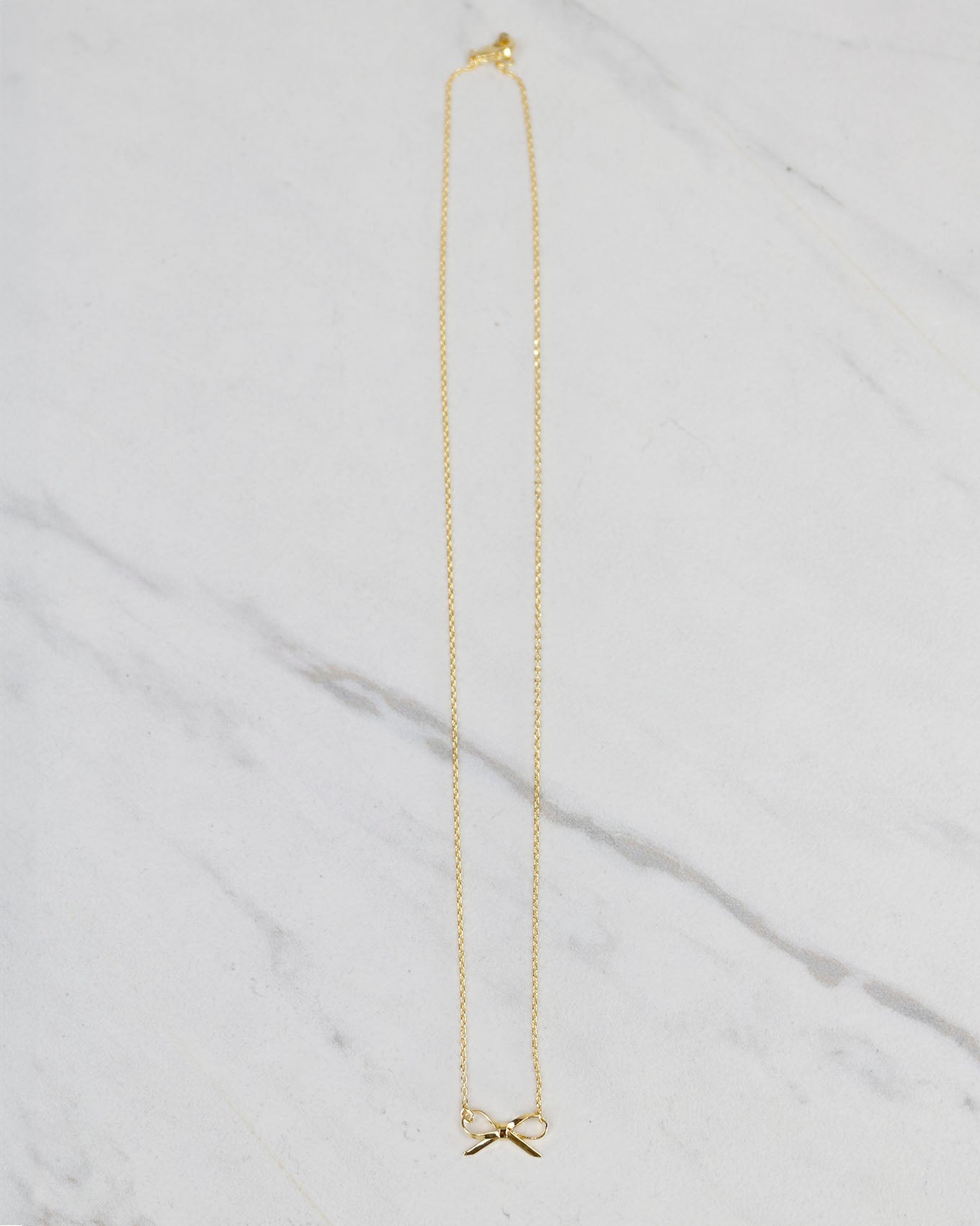 Gold bow necklace