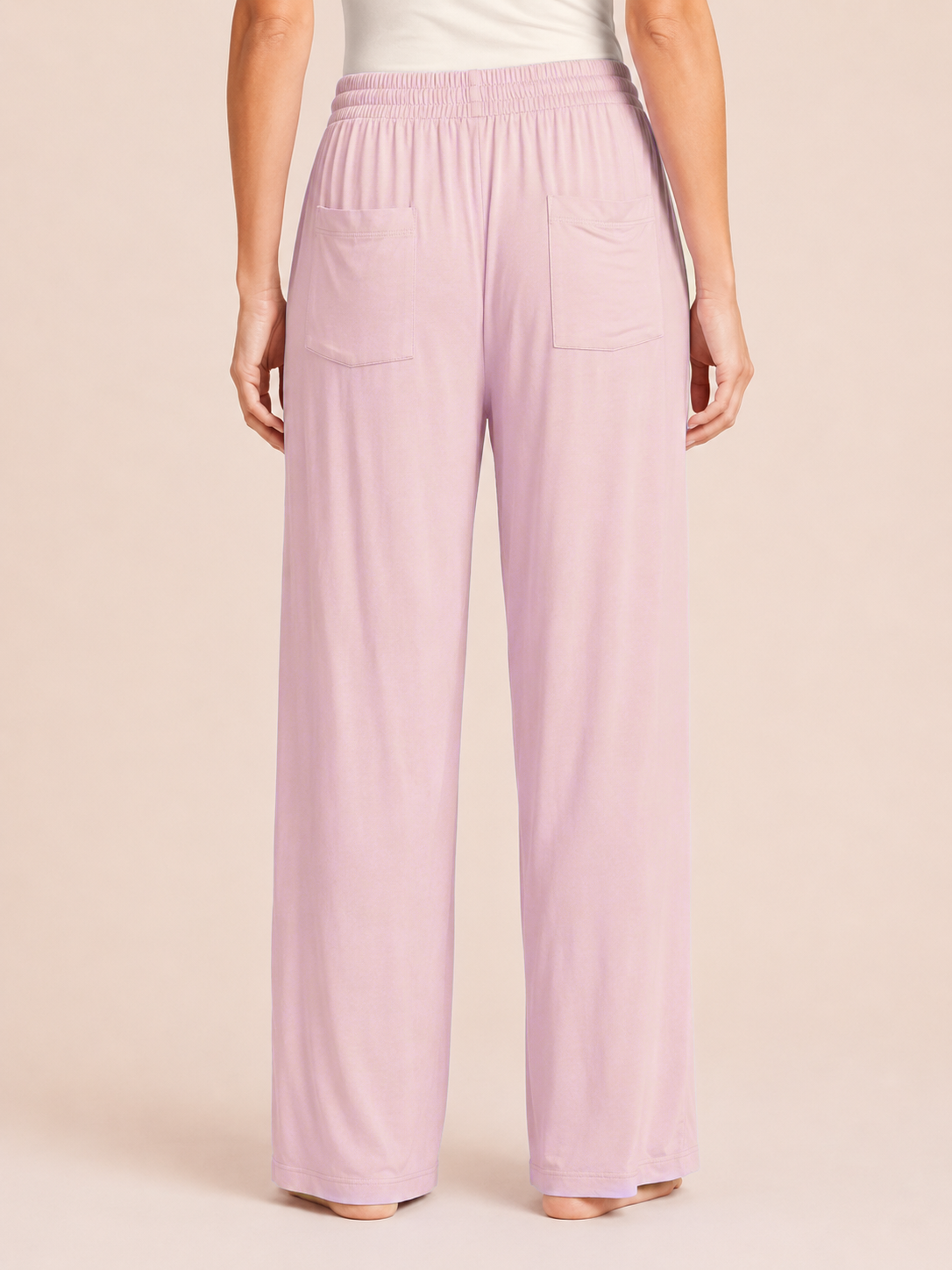 Back view of Mauve Mist wide-leg pajama pants on a beige background