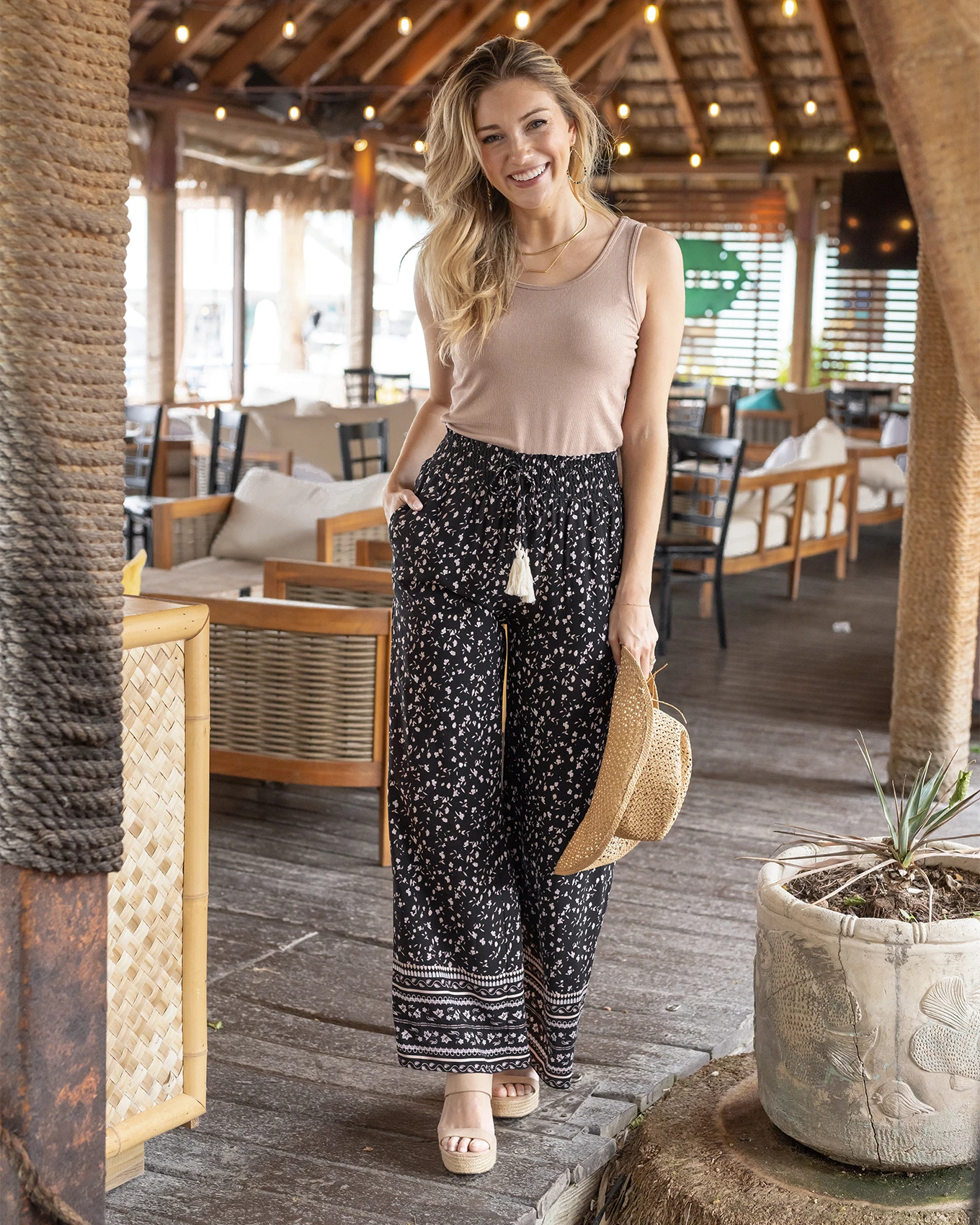 Wide leg black pants on model