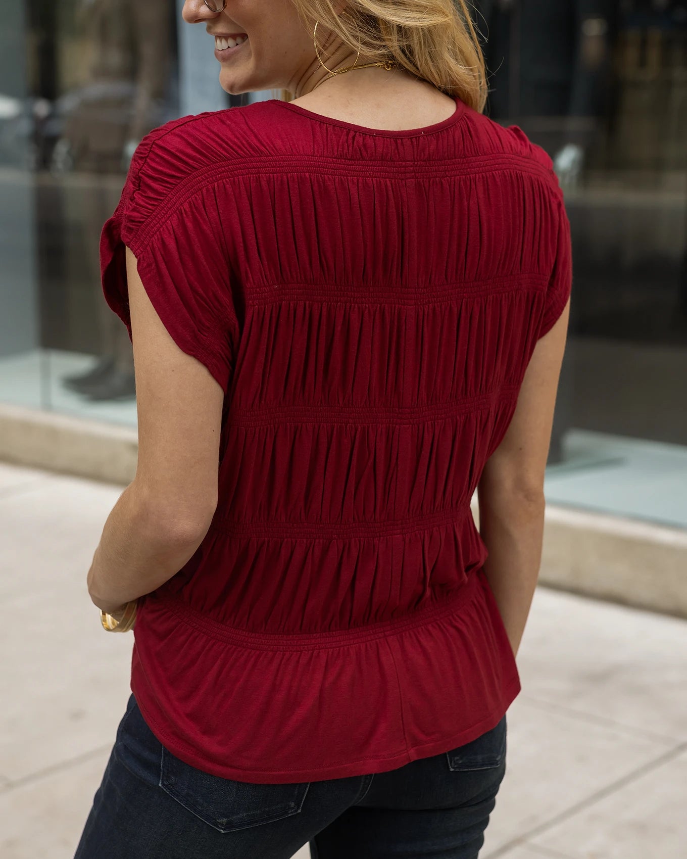 Back view red smocked top