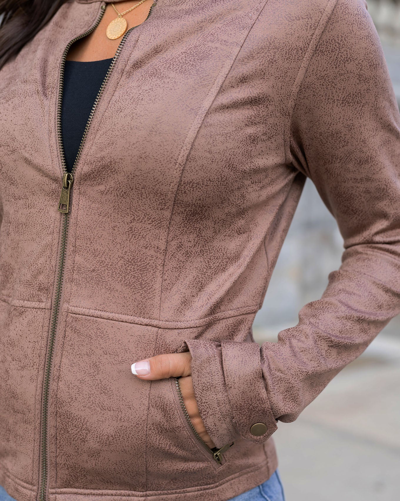 detail view of taupe leather like cafe racer jacket