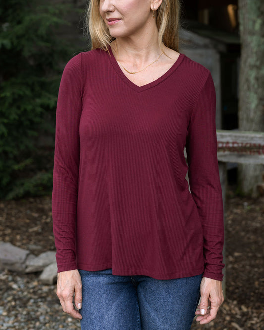 close up view of ribbed long sleeve top in wine