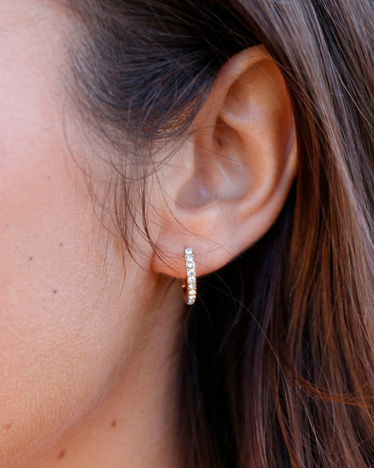 View of Gold Pave Huggie Earrings worn