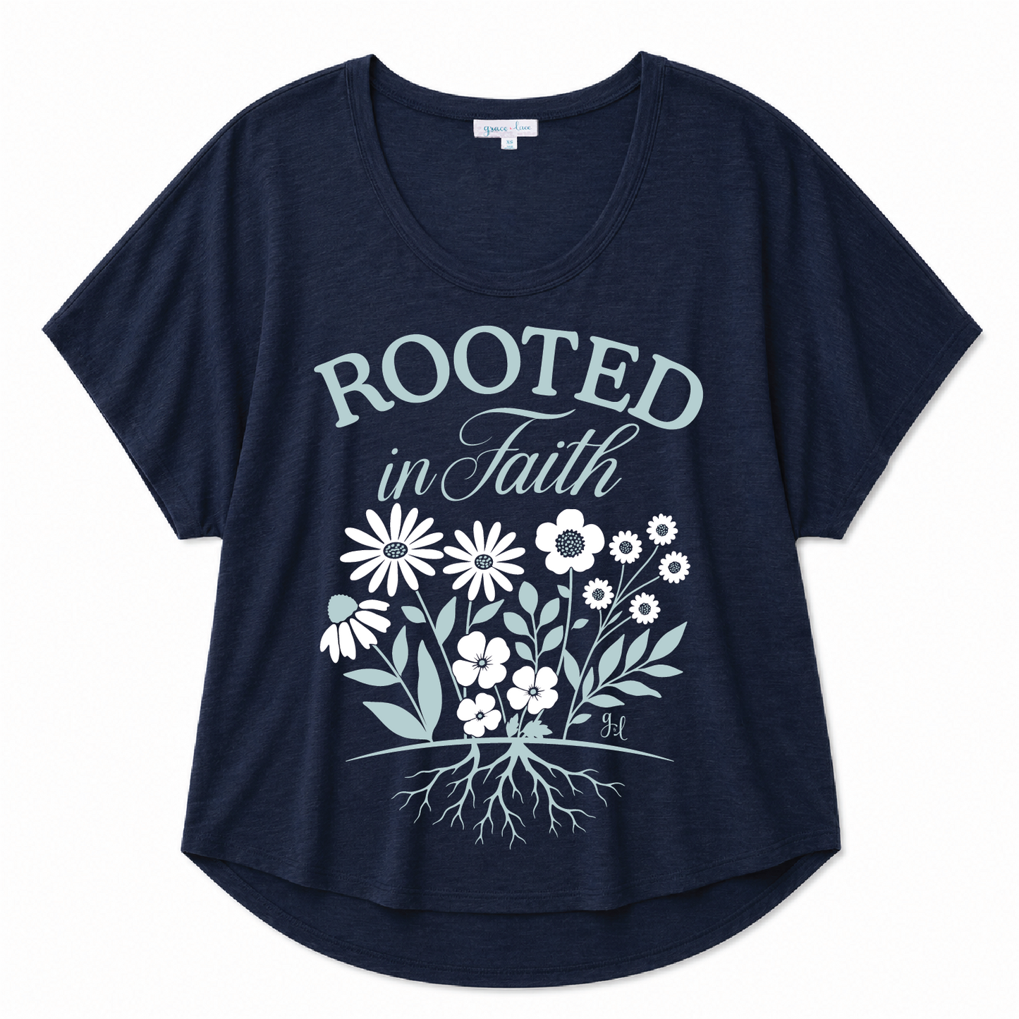 Navy blue scoop neck tee featuring a "Rooted in Faith" floral graphic with a botanical root design on a white background