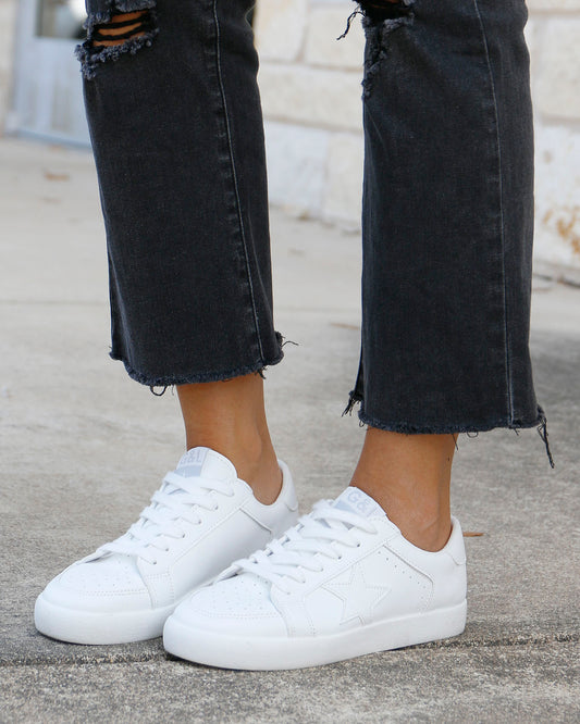 side view of white star sneakers