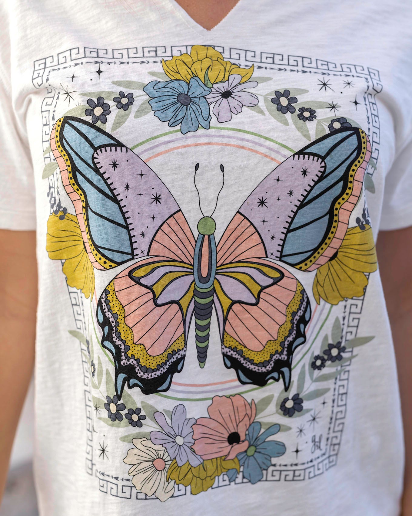 Close up view of Butterfly Notched Neck Washed & Worn Graphic Tee