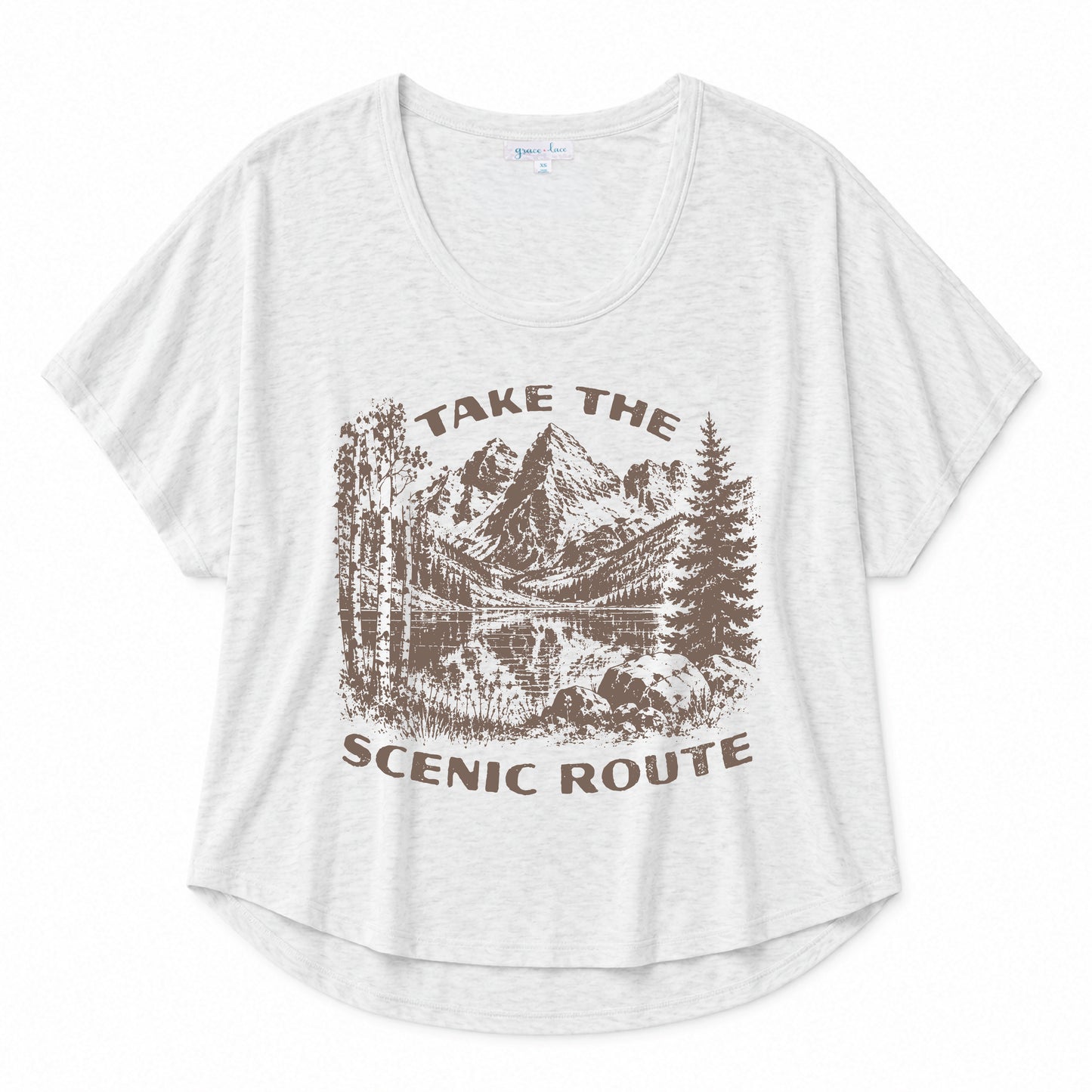 Navy graphic tee featuring a "Peace Comes in Waves" design on a beige background