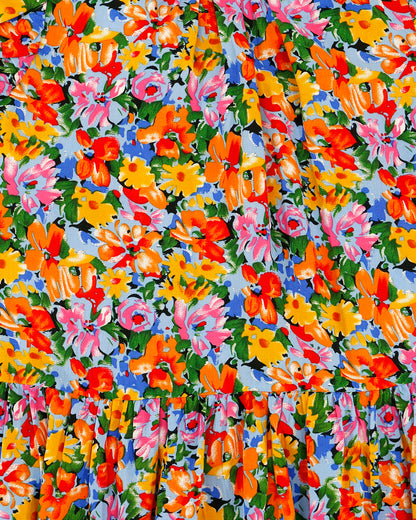 close up stock shot of the freesia floral pattern and print of ruffle sleeve women's blouse
