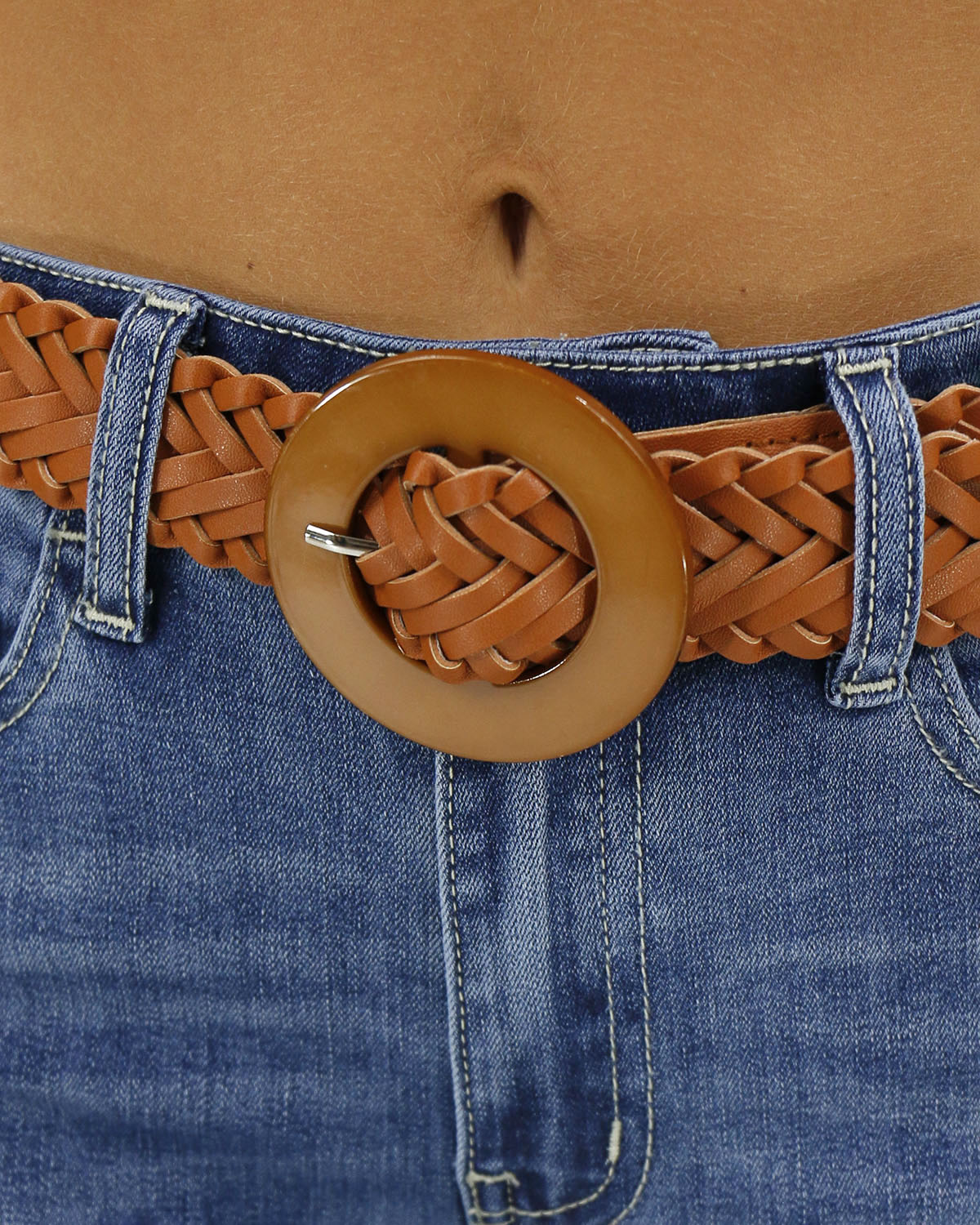 Close up stock image of buckle on women's braided faux leather belt
