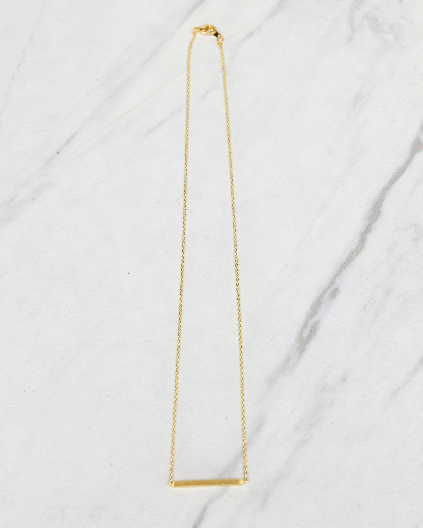 Stock shot of Brushed Gold Bar Necklace