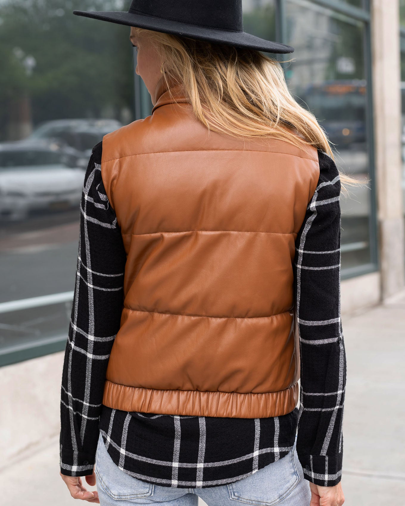 back view of cognac faux leather puffer vest