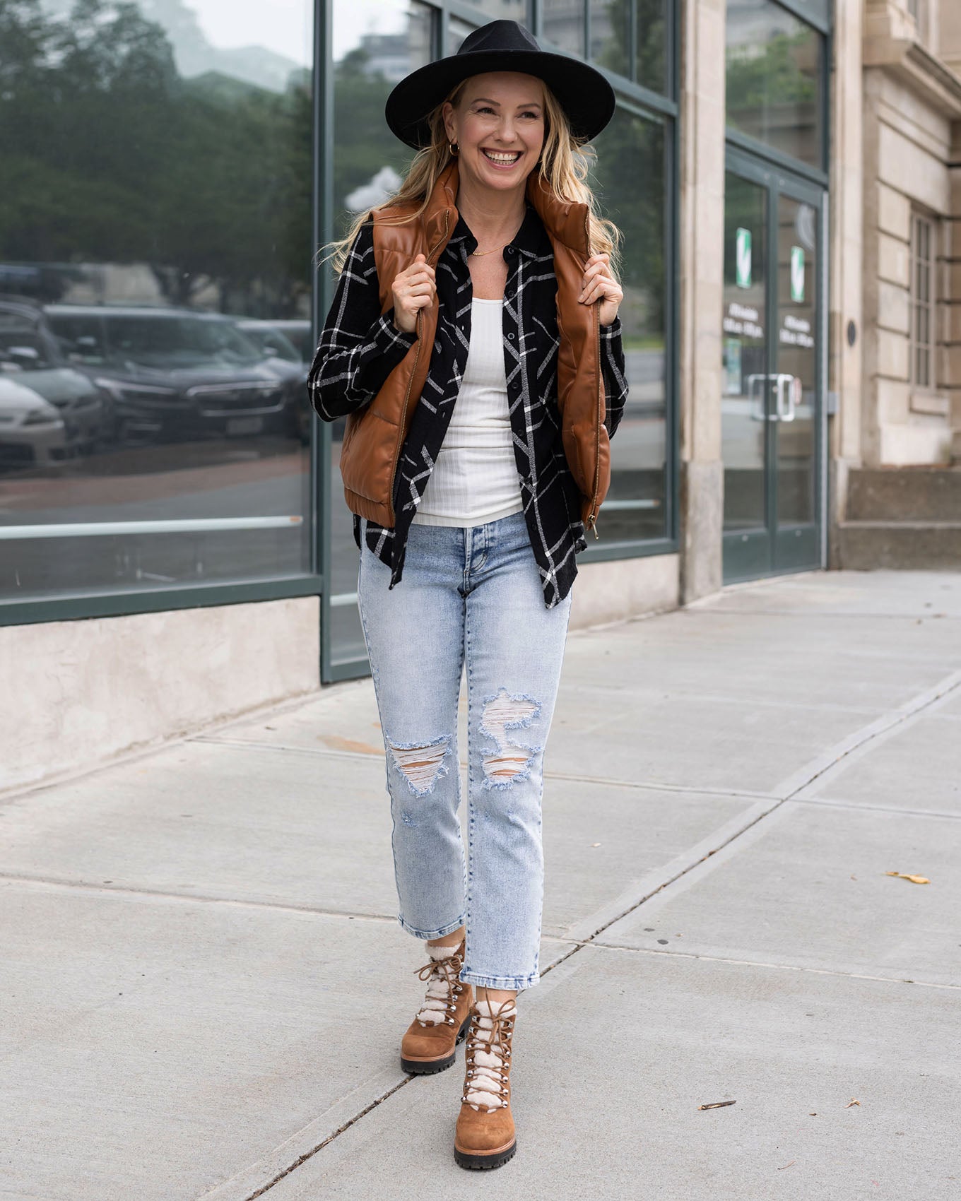 full body view of cognac faux leather puffer vest