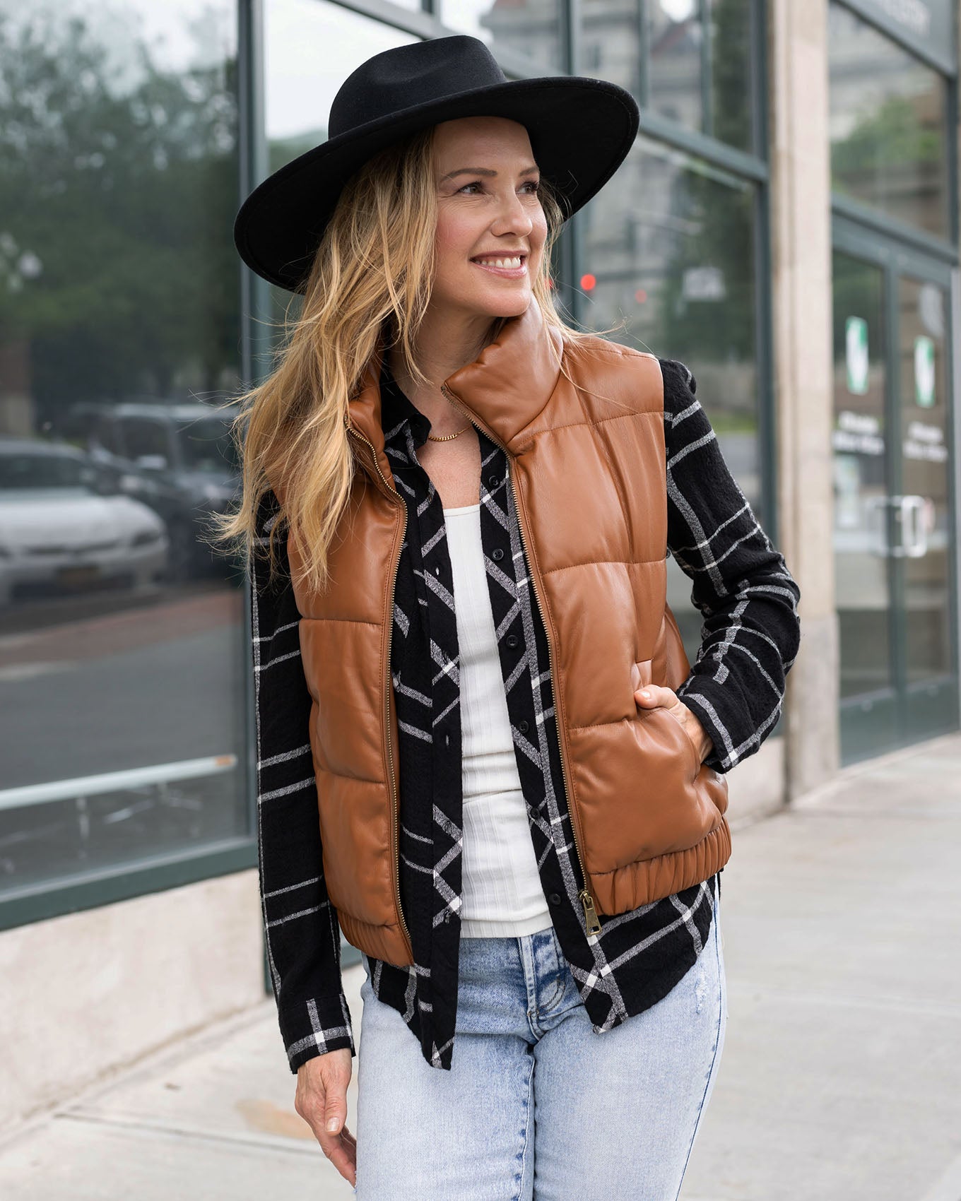 close up view of cognac faux leather puffer vest