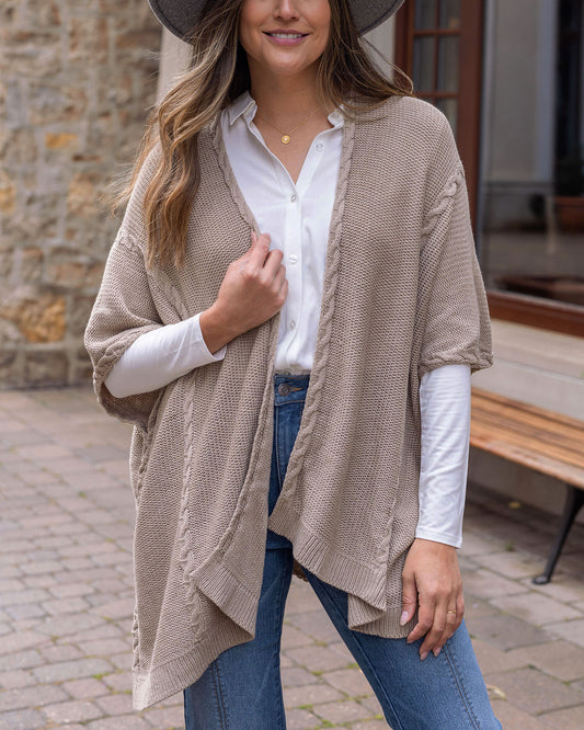 front view of taupe cabled poncho