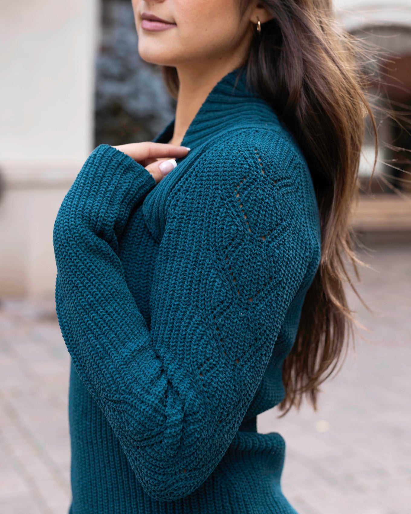 detail view of cabled sleeve shrug sweater