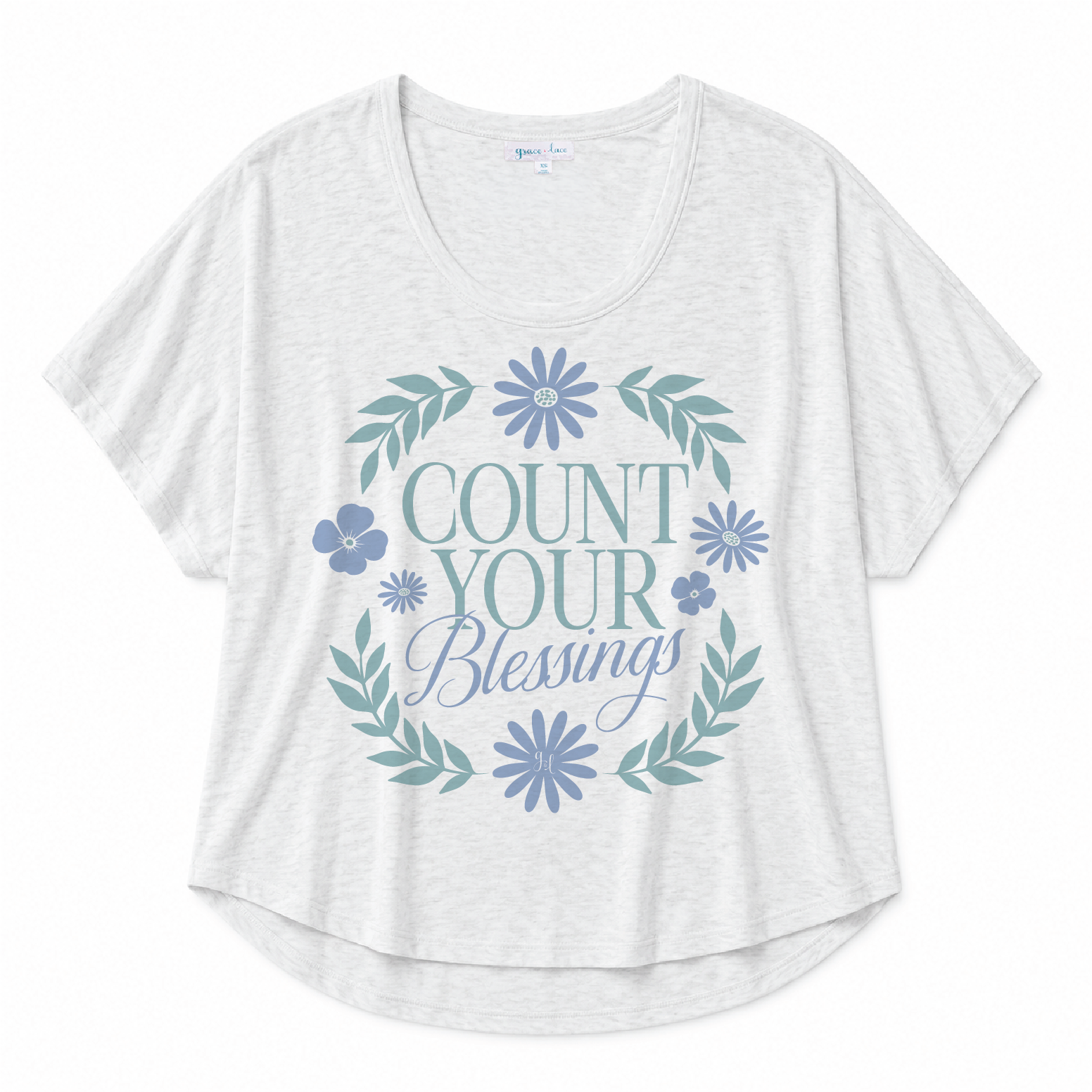 White scoop neck tee featuring a "Count Your Blessings" floral graphic in blue and green tones on a white background