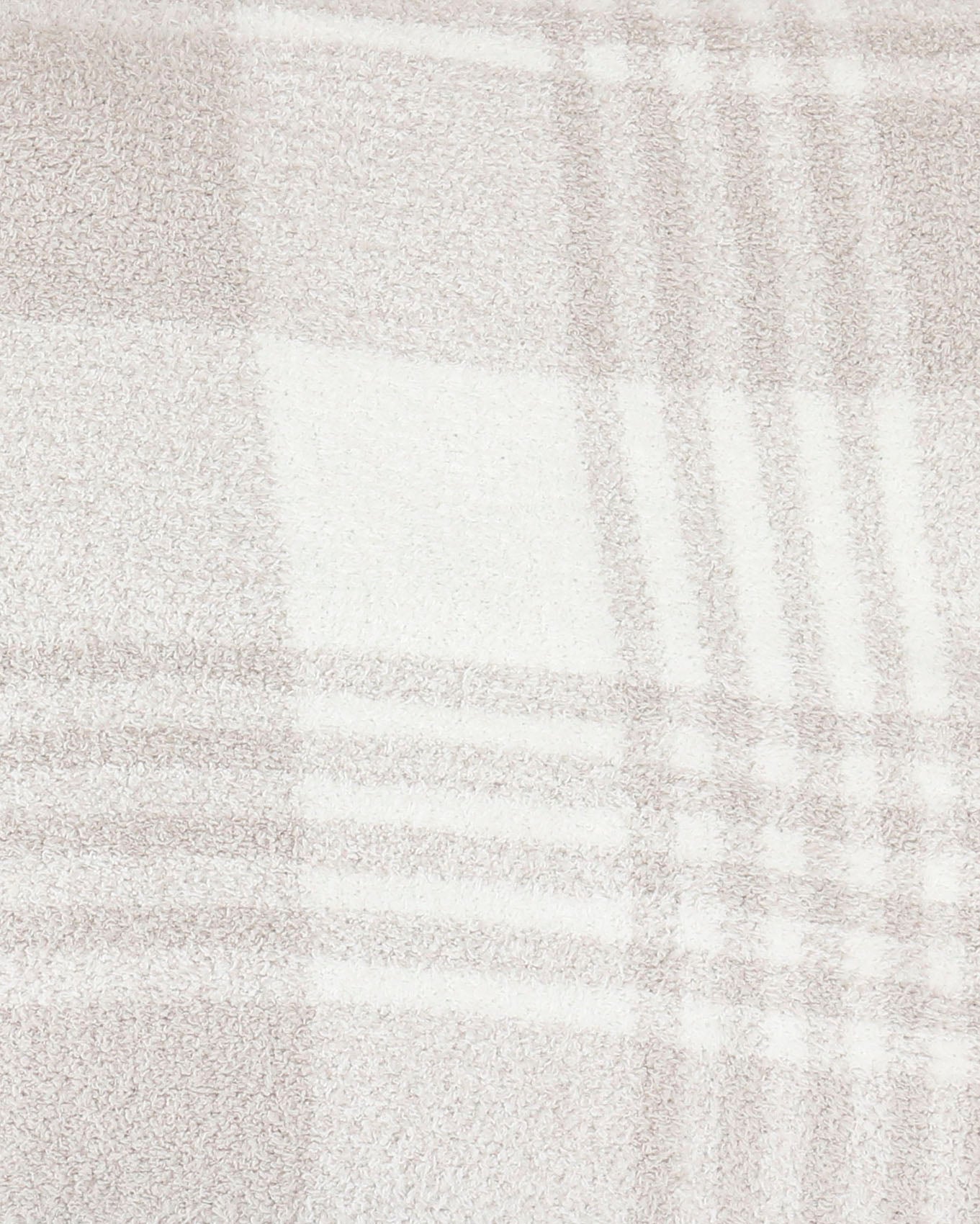 detail view of neutral plaid blanket