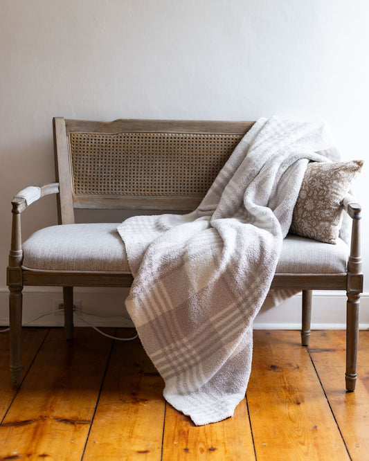 styled view of neutral plaid blanket