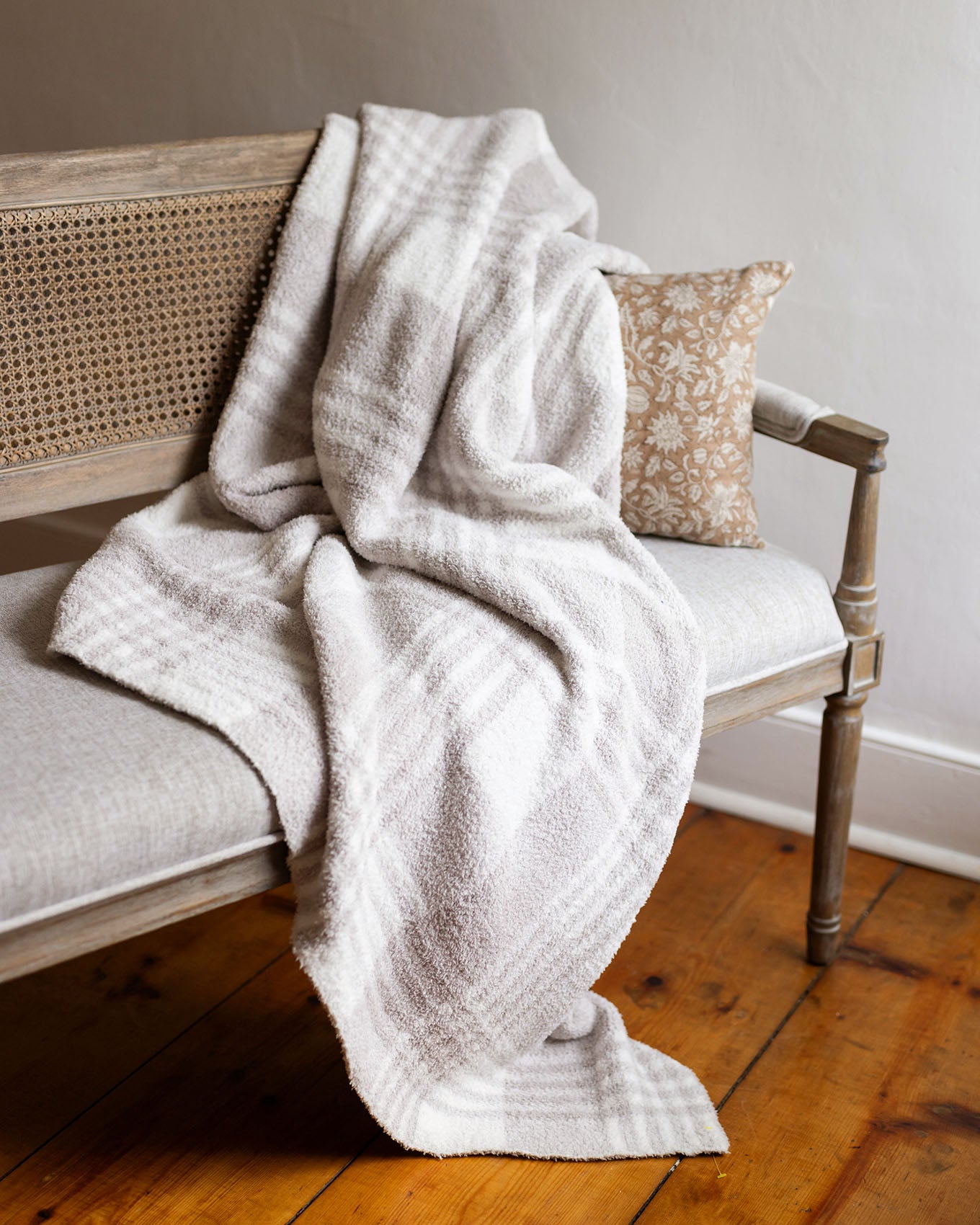 styled view of neutral plaid blanket