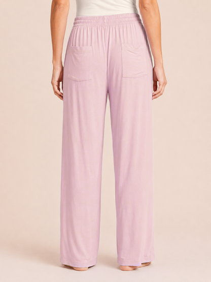 Back view of Mauve Mist wide-leg pajama pants on a beige background