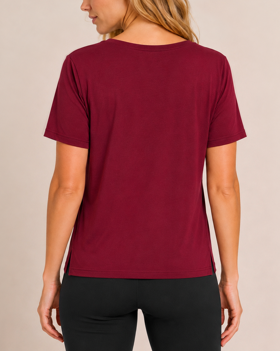 Back view of a woman wearing a cabernet pajama top with matching wide-leg pants on a beige background