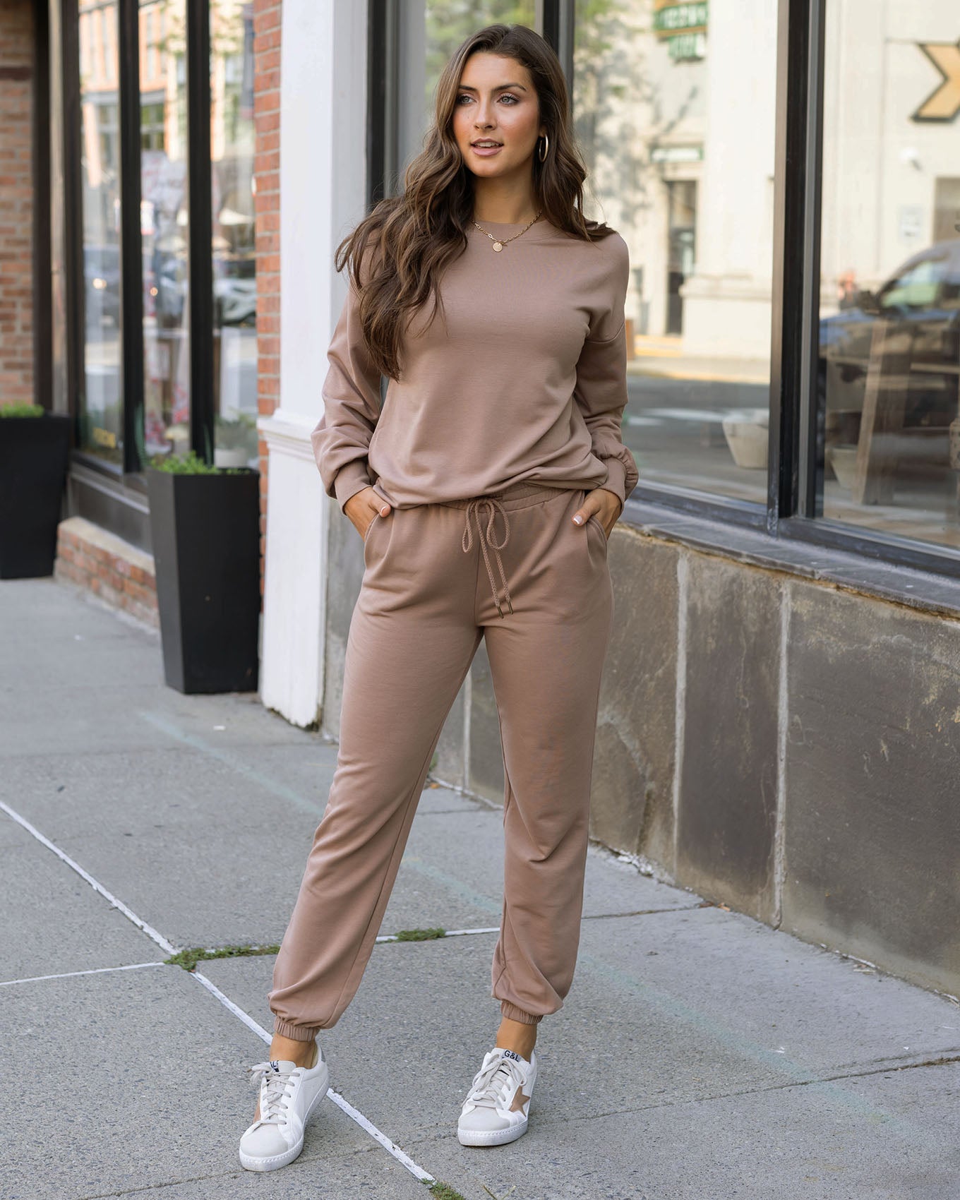 full body view of soft tan sweatshirt