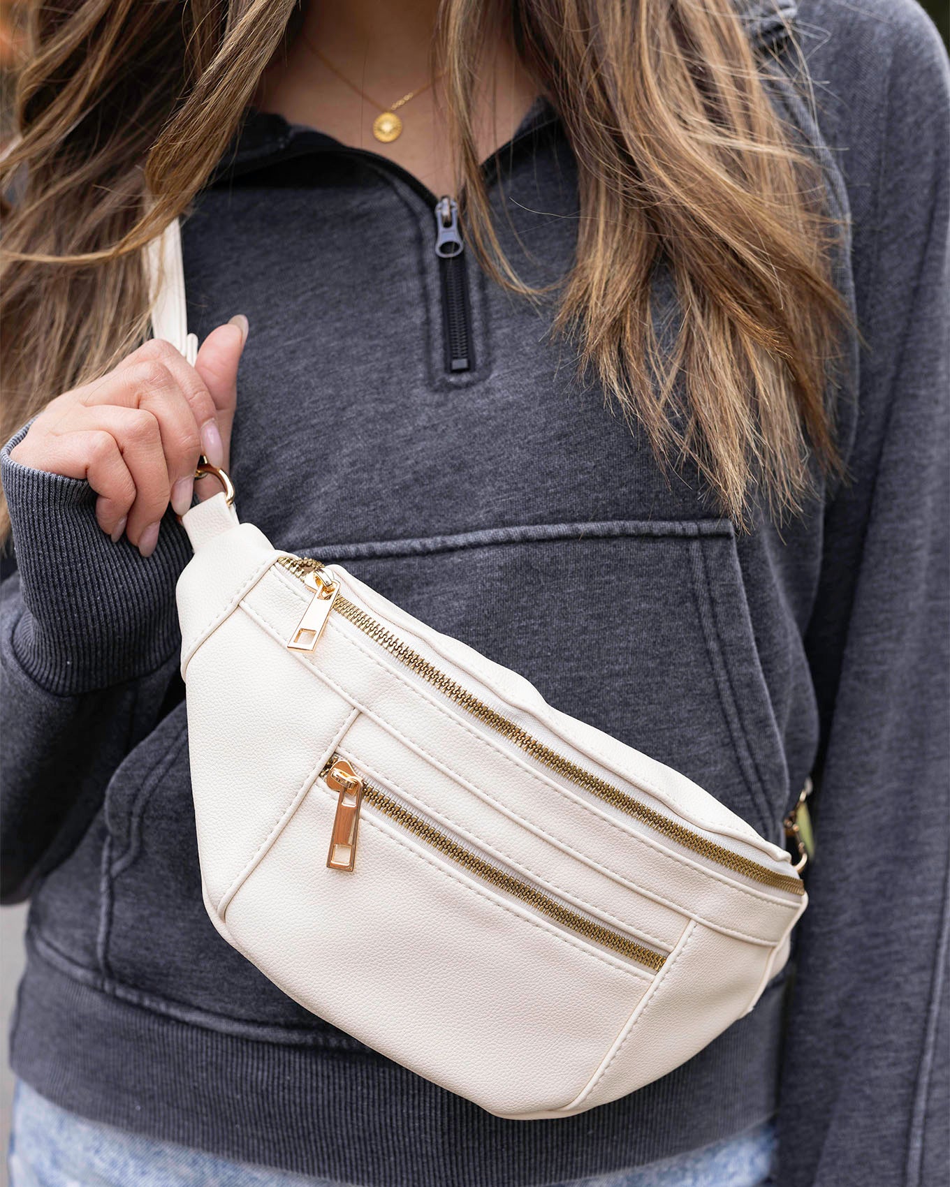 close up view of Ivory Faux Leather Belt Bag with Guitar Strap