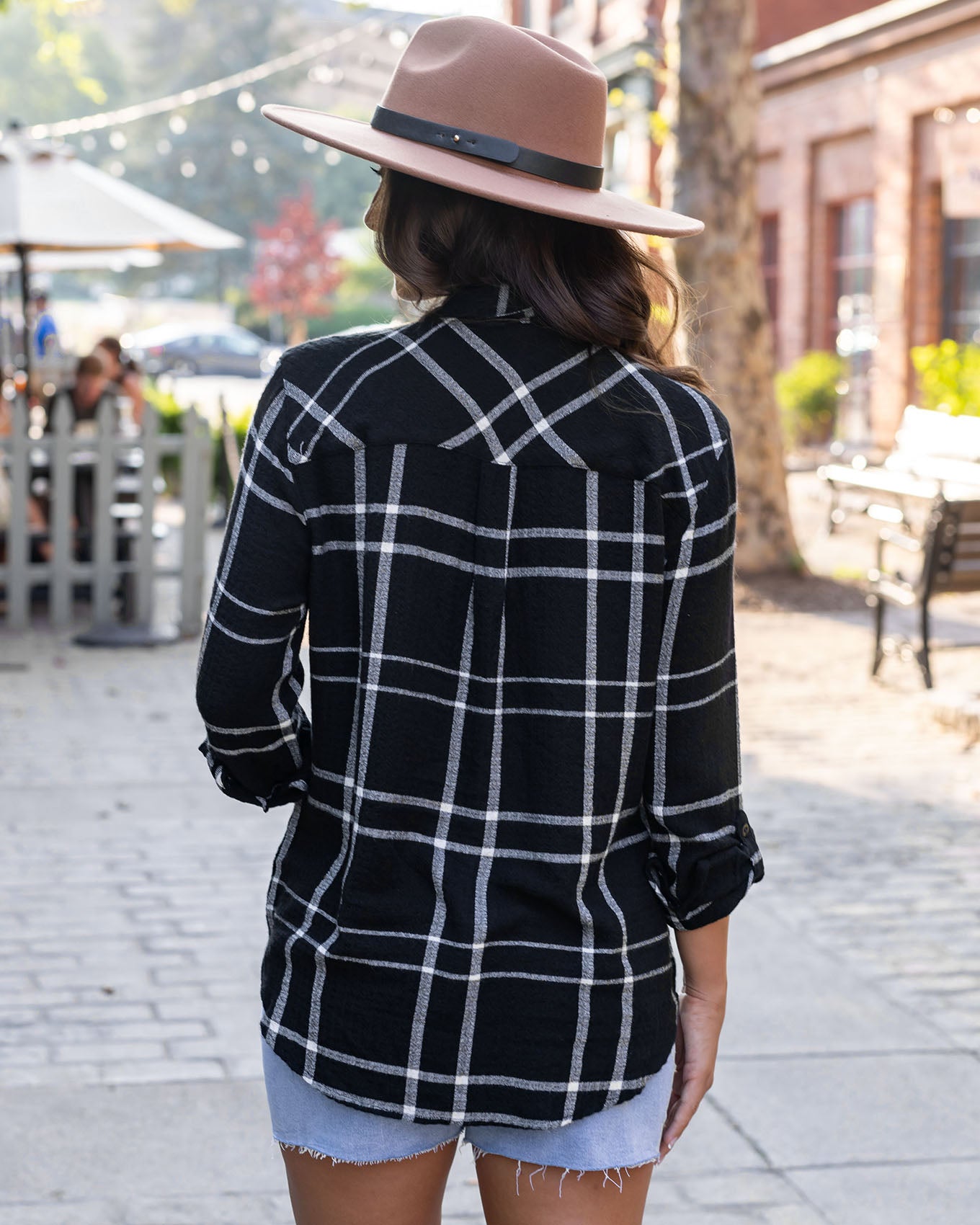 back view of favorite button up top in black plaid