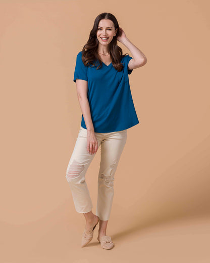 Woman wearing a Perfect Fit V-Neck Pocket Tee - Teal  and natural colored distressed denim