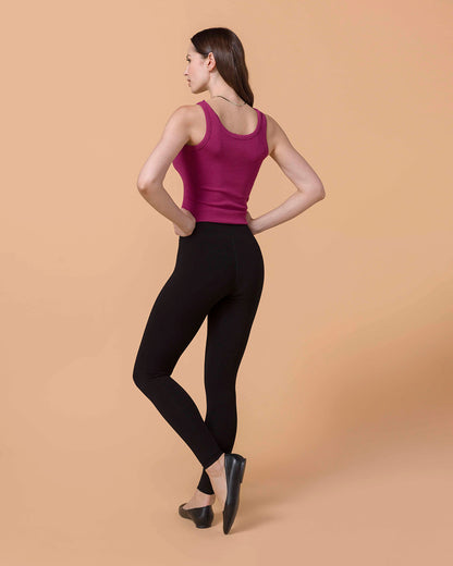 Brunette Model wearing Signature High-Rise Black Leggings and berry brami back view