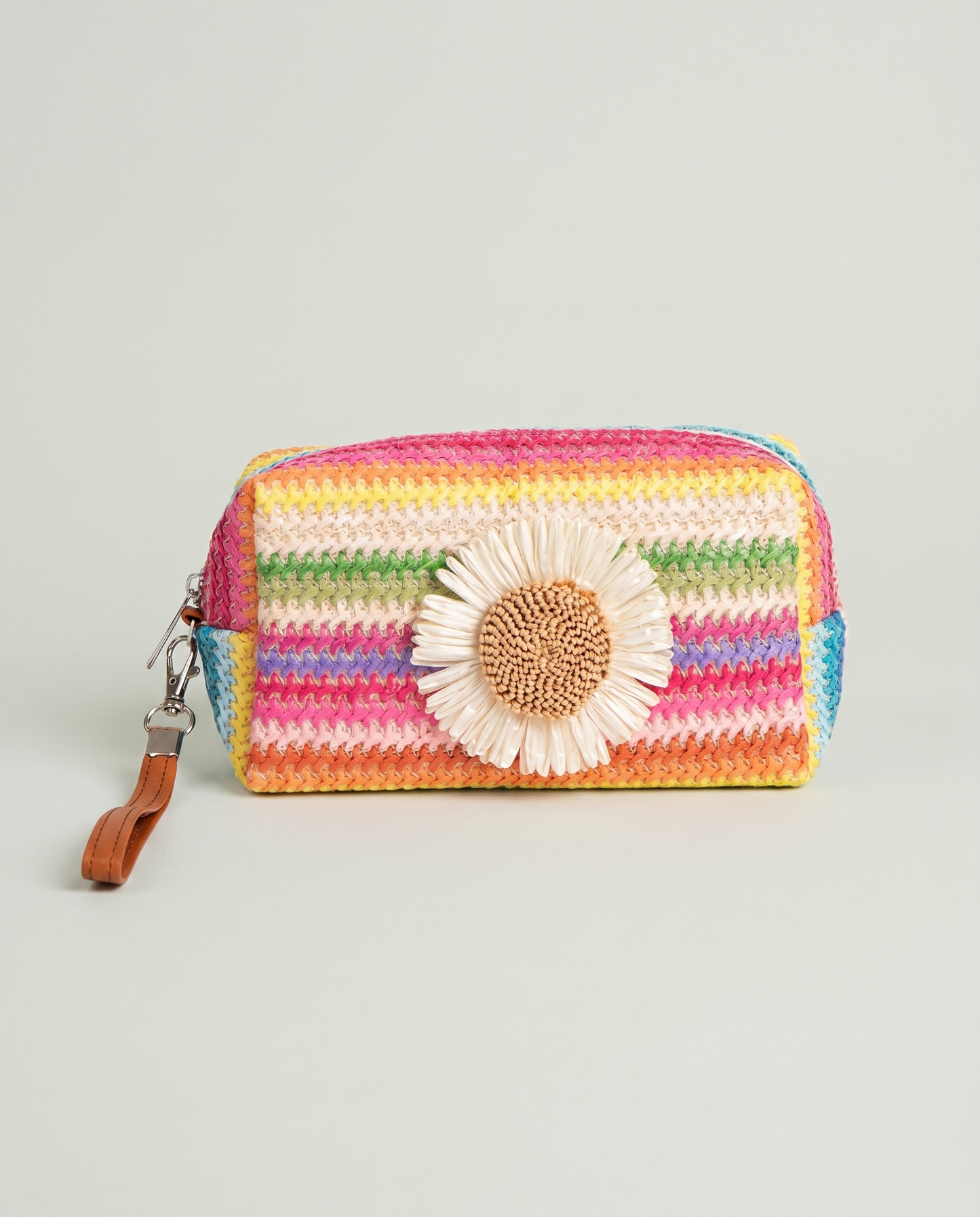 Front view of Daisy Striped Summer Wristlet in Pink with daisy embellishment