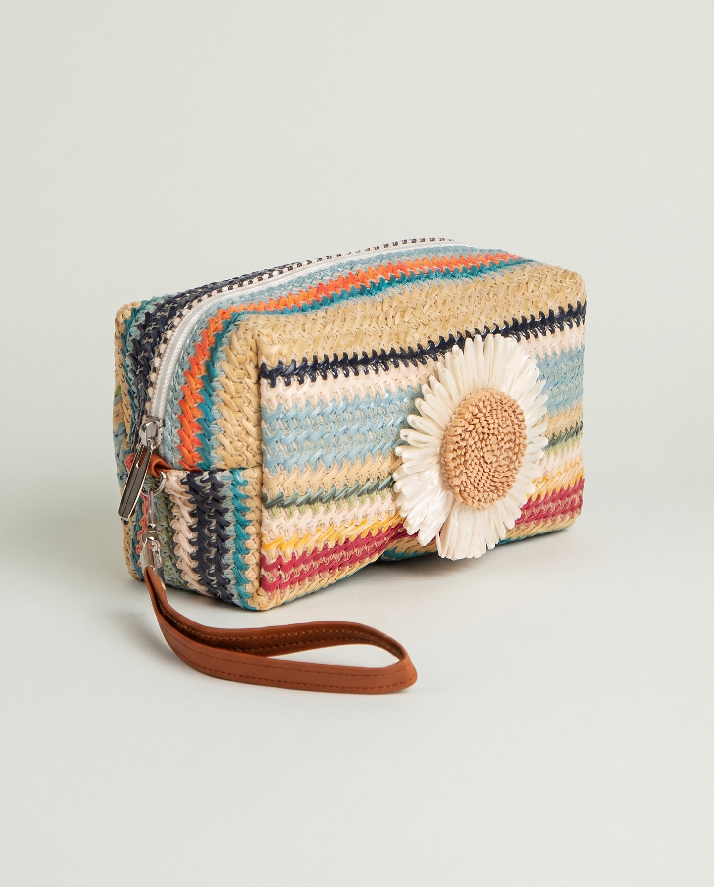 Angled view of Daisy Striped Summer Wristlet in Blue with colorful striped design
