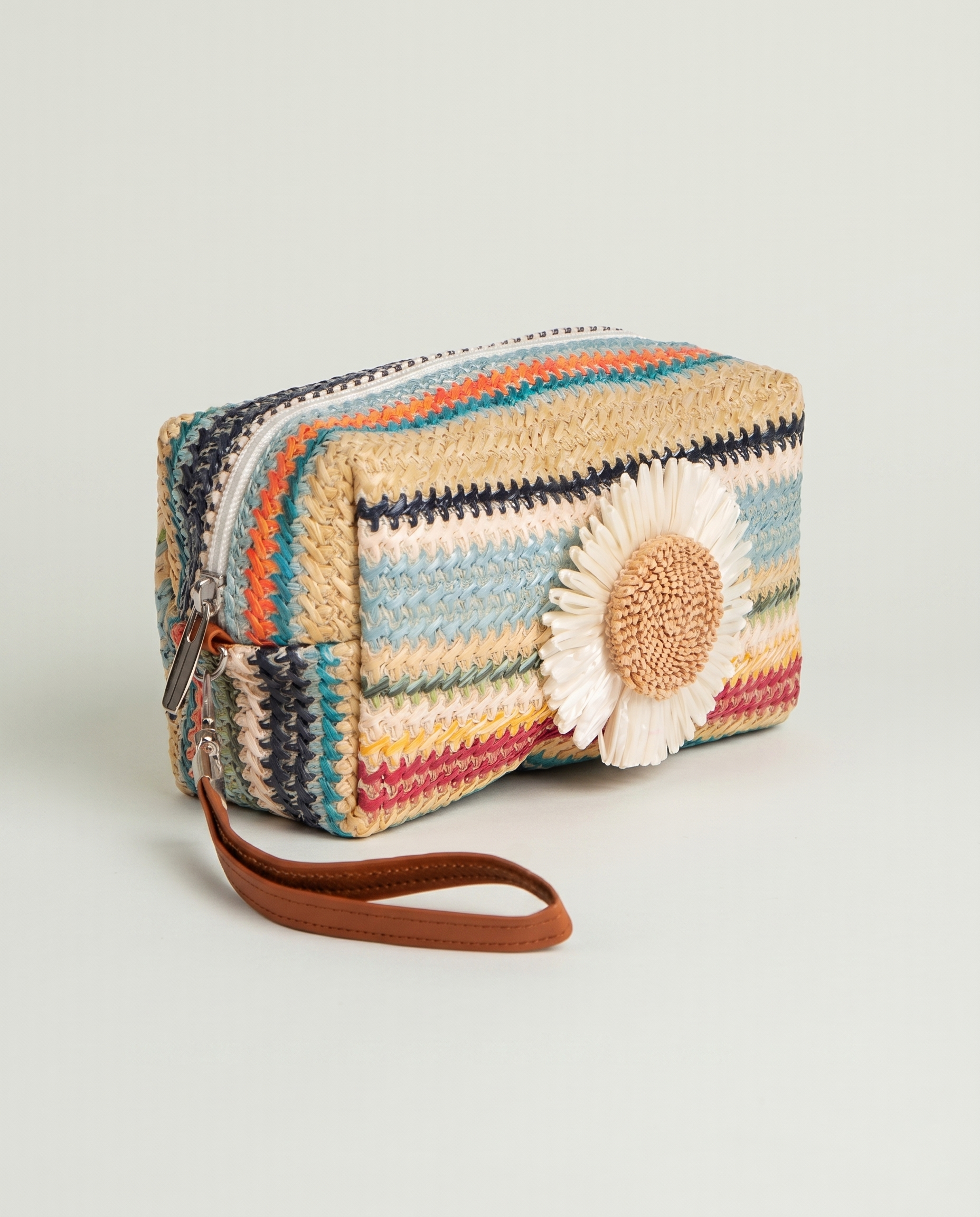 Angled view of Daisy Striped Summer Wristlet in Blue with colorful striped design