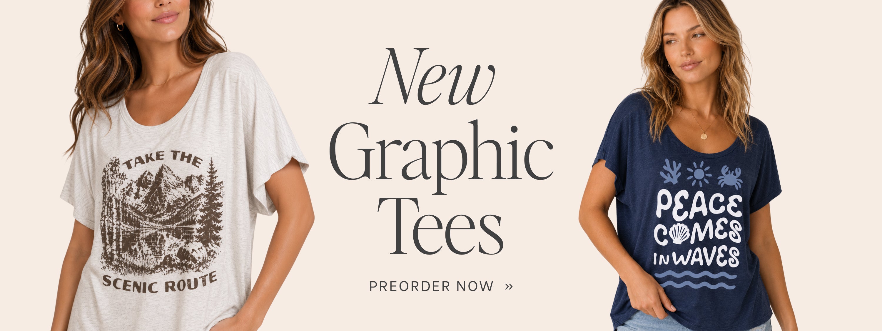 Two women modeling graphic tees against a light beige background with the text 'New Graphic Tees' and 'PREORDER NOW'. The woman on the left wears a white oversized t-shirt with a black mountain graphic and the words 'TAKE THE SCENIC ROUTE'.