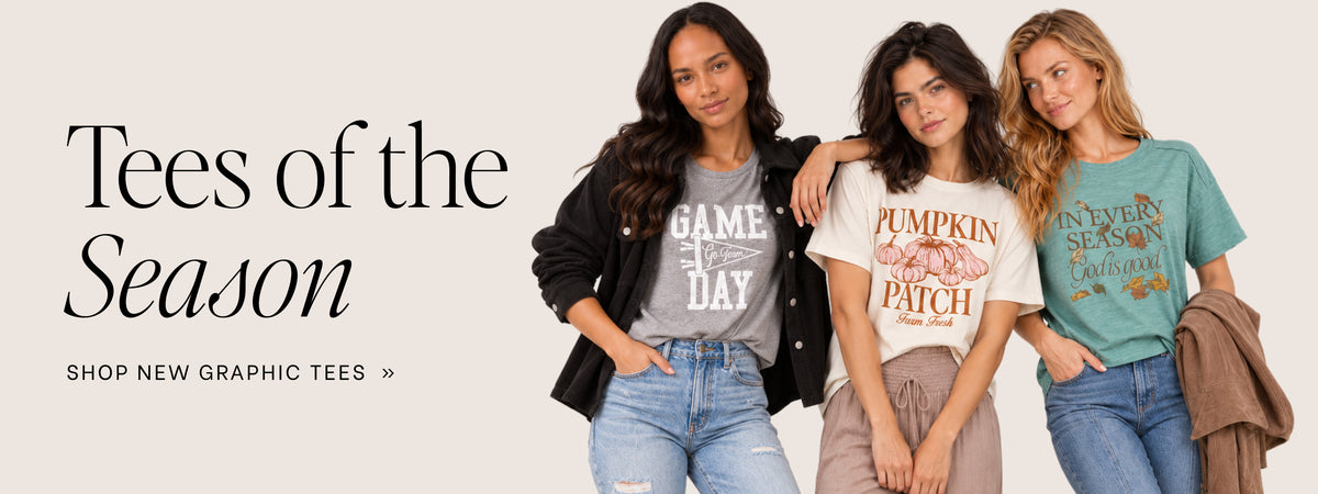 Three women modeling graphic tees against a light beige background with the text 'Tees of the Season' on the left. The tees include a gray 'GAME DAY' shirt, a cream 'PUMPKIN PATCH' shirt, and a teal 'IN EVERY Season CALIFORNIA' shirt.