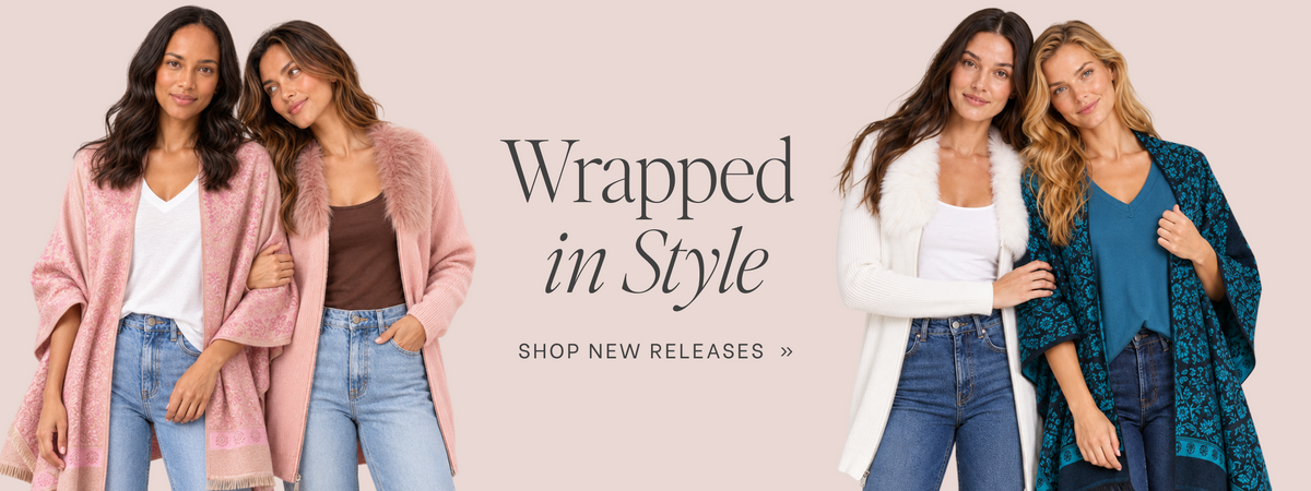 A promotional banner featuring four models wearing various wrapped cardigans and open-front outerwear, set against a solid pale pink background with the text 'Wrapped in Style' and 'SHOP NEW RELEASES >>'.