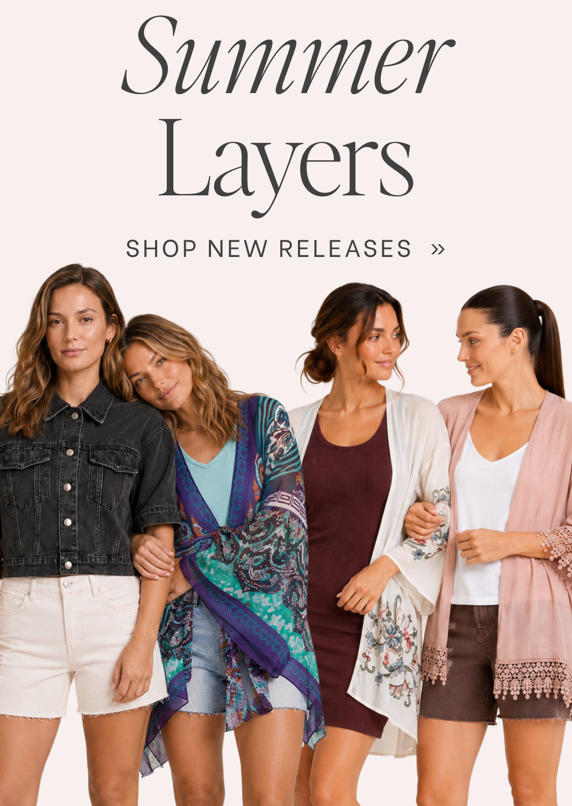 Four women standing together against a pale pink background with the text 'Summer Layers' and 'SHOP NEW RELEASES >>' above them. They are wearing layered summer outfits in different colorways, including denim, blue and purple paisley, burgundy and cream, and white and pink.