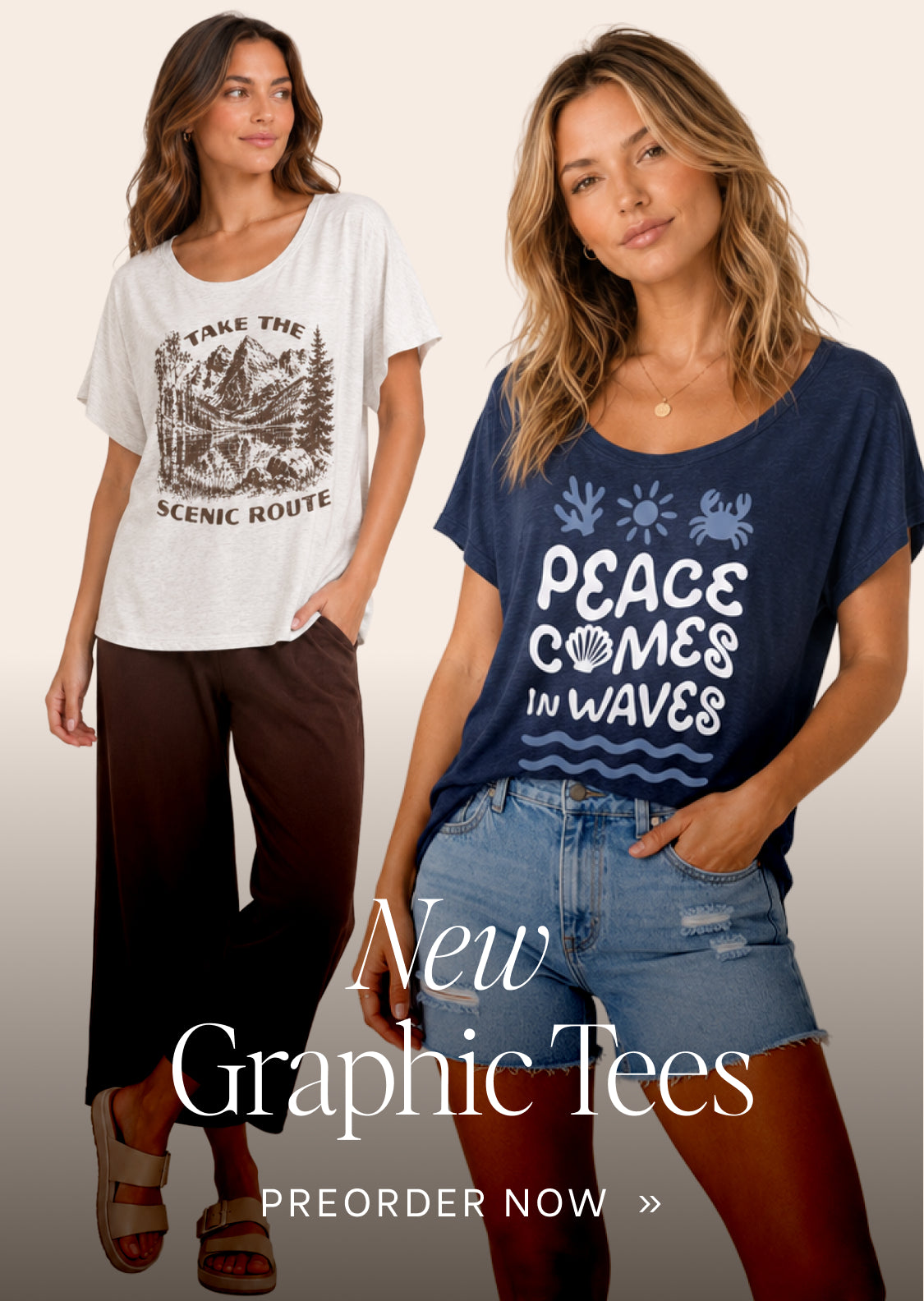 Two women modeling graphic tees against a light beige background. The woman on the left wears a white oversized t-shirt with a black scenic route graphic and dark brown pants.