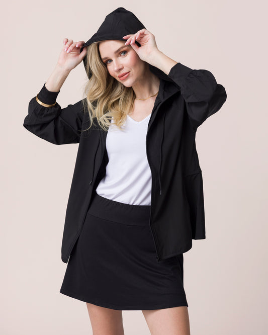 Everyday Active Skort in Black on Model with Black Jacket and White Tank