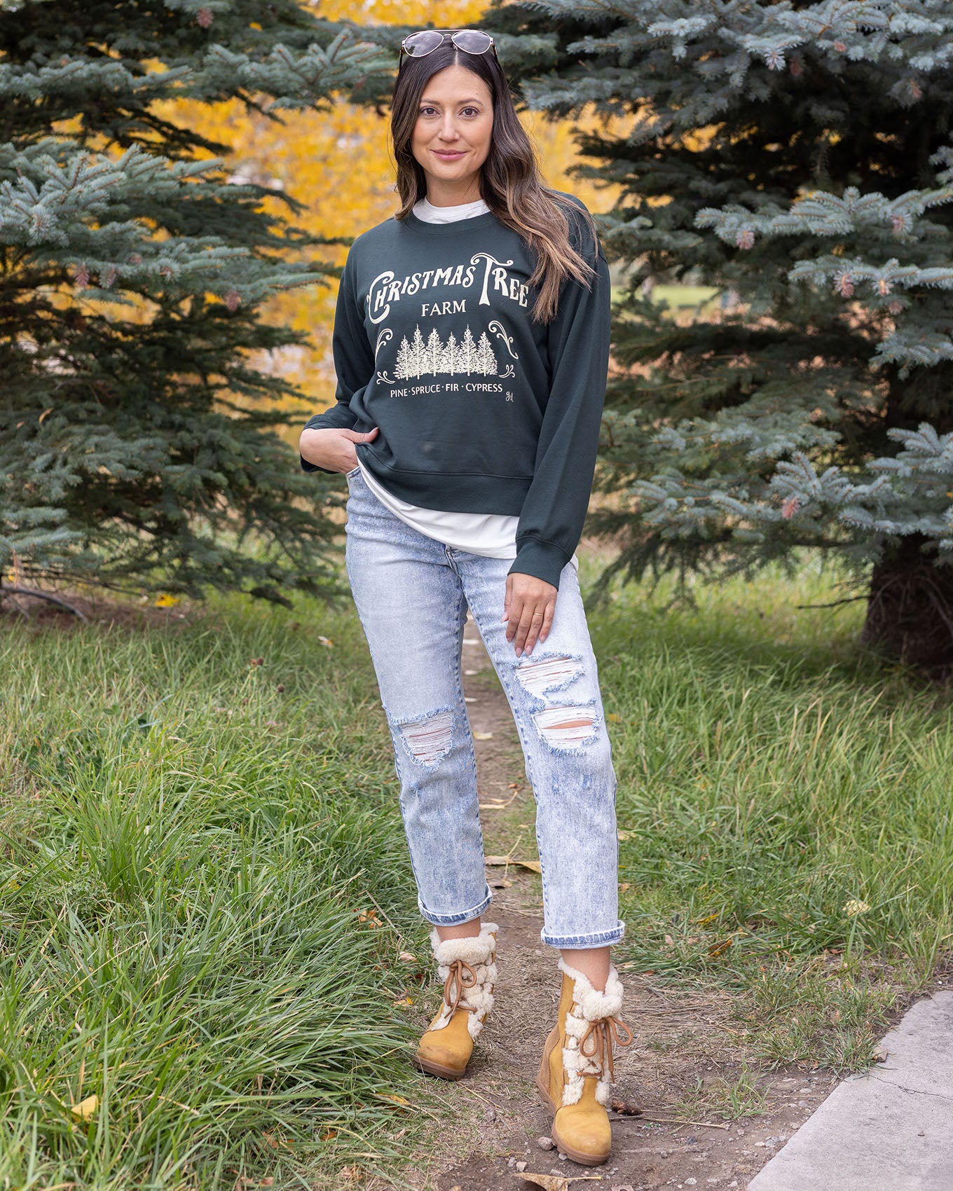 full body view of christmas tree farm graphic sweatshirt