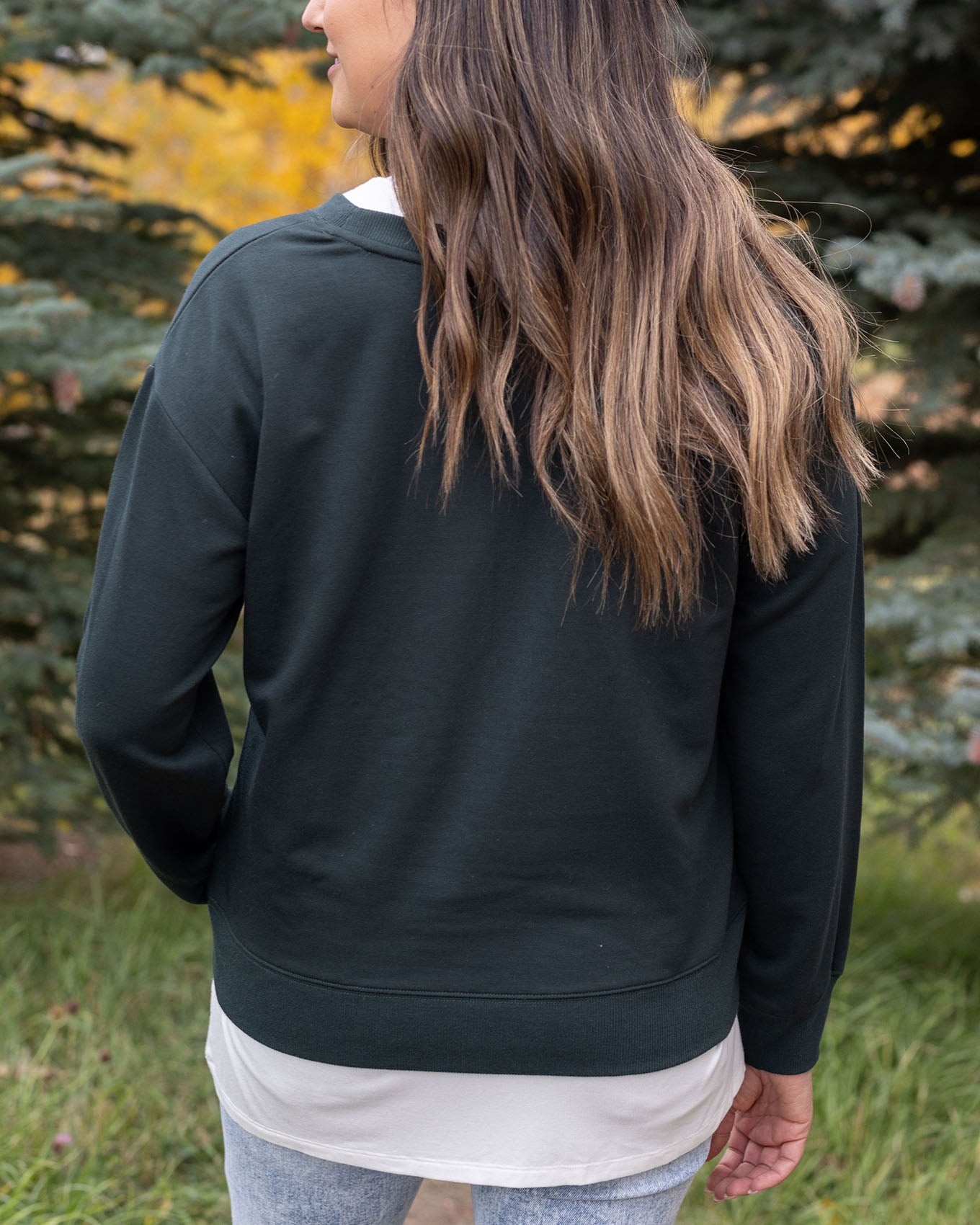 back view of christmas tree farm graphic sweatshirt