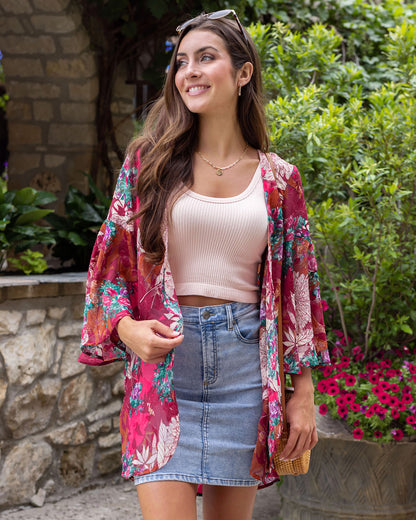 Front styled view of floral kimono with denim skirt and brami