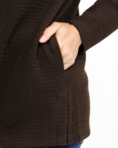 detail view stock shot of brown ribbed shacket