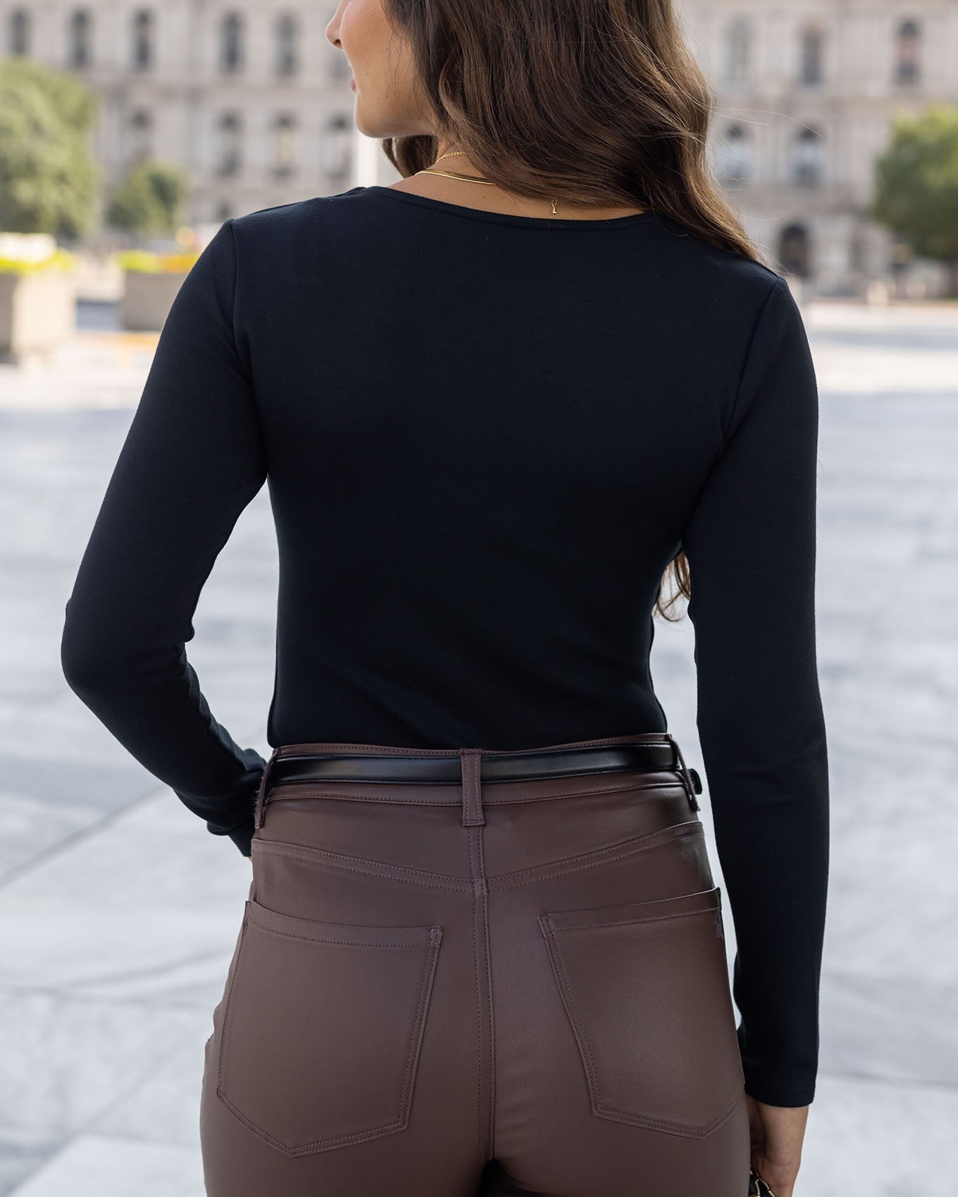 back view of black luxe long sleeve bodysuit