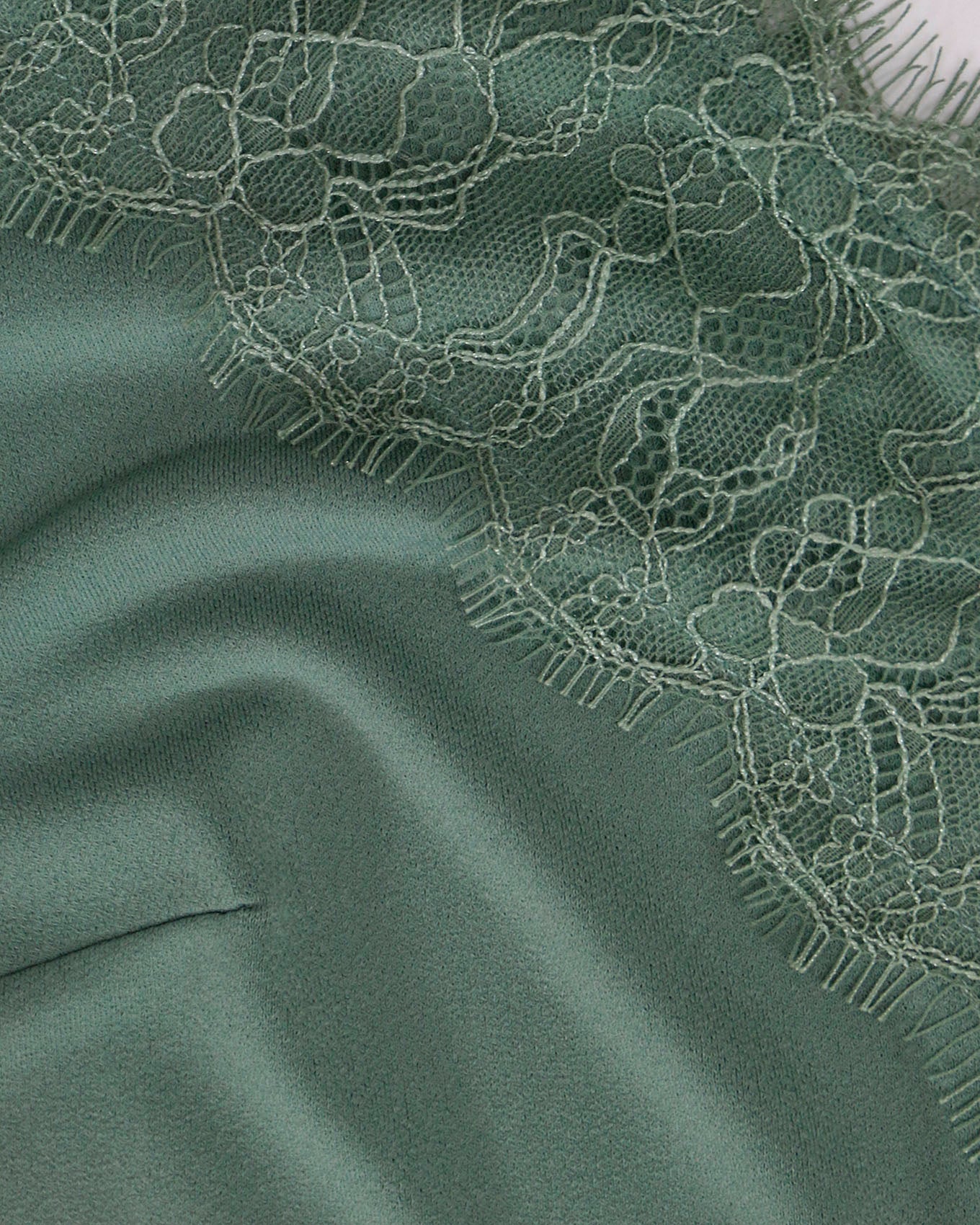 close up of button lace trim cami