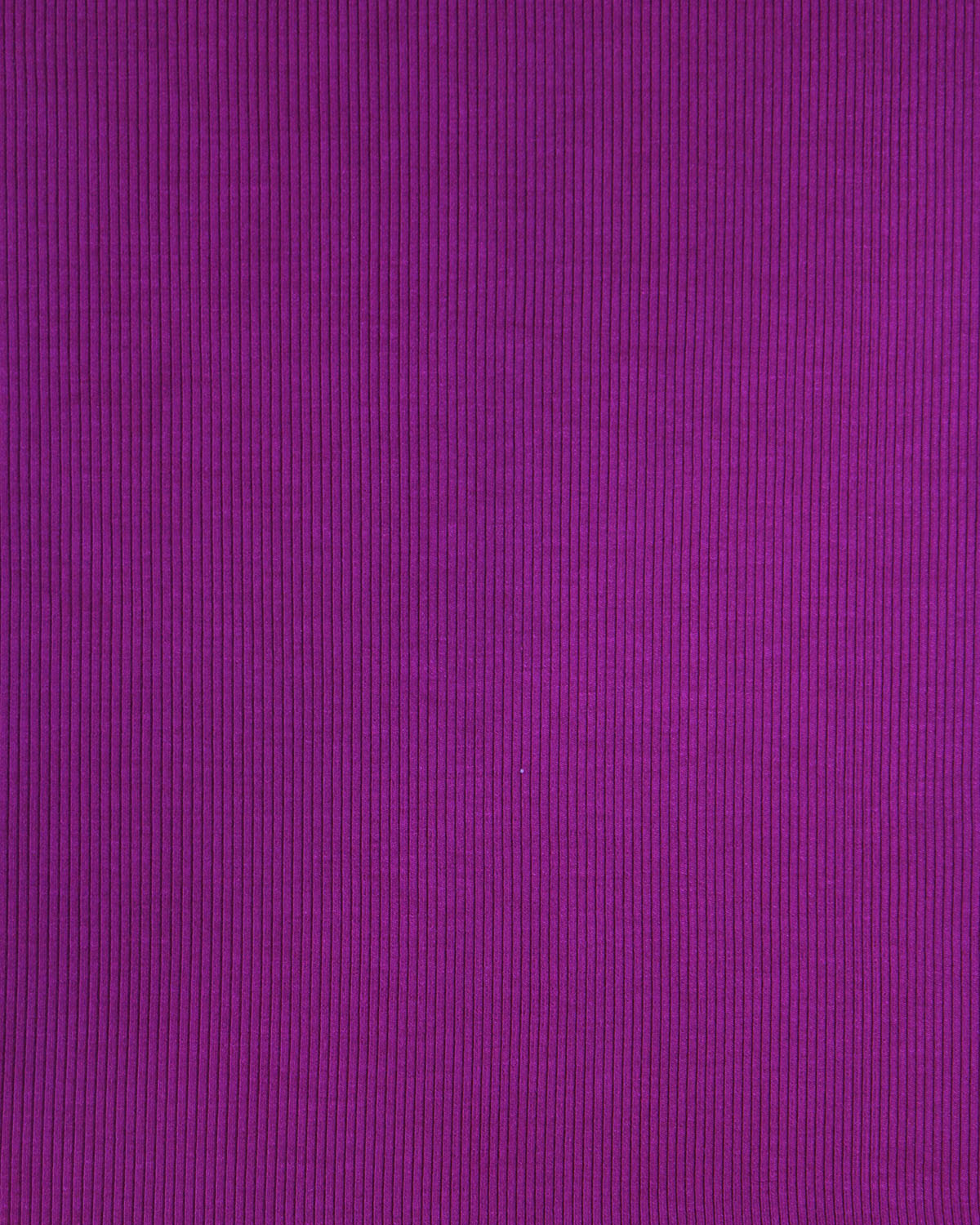 Close up of fabric on magenta ribbed knit top