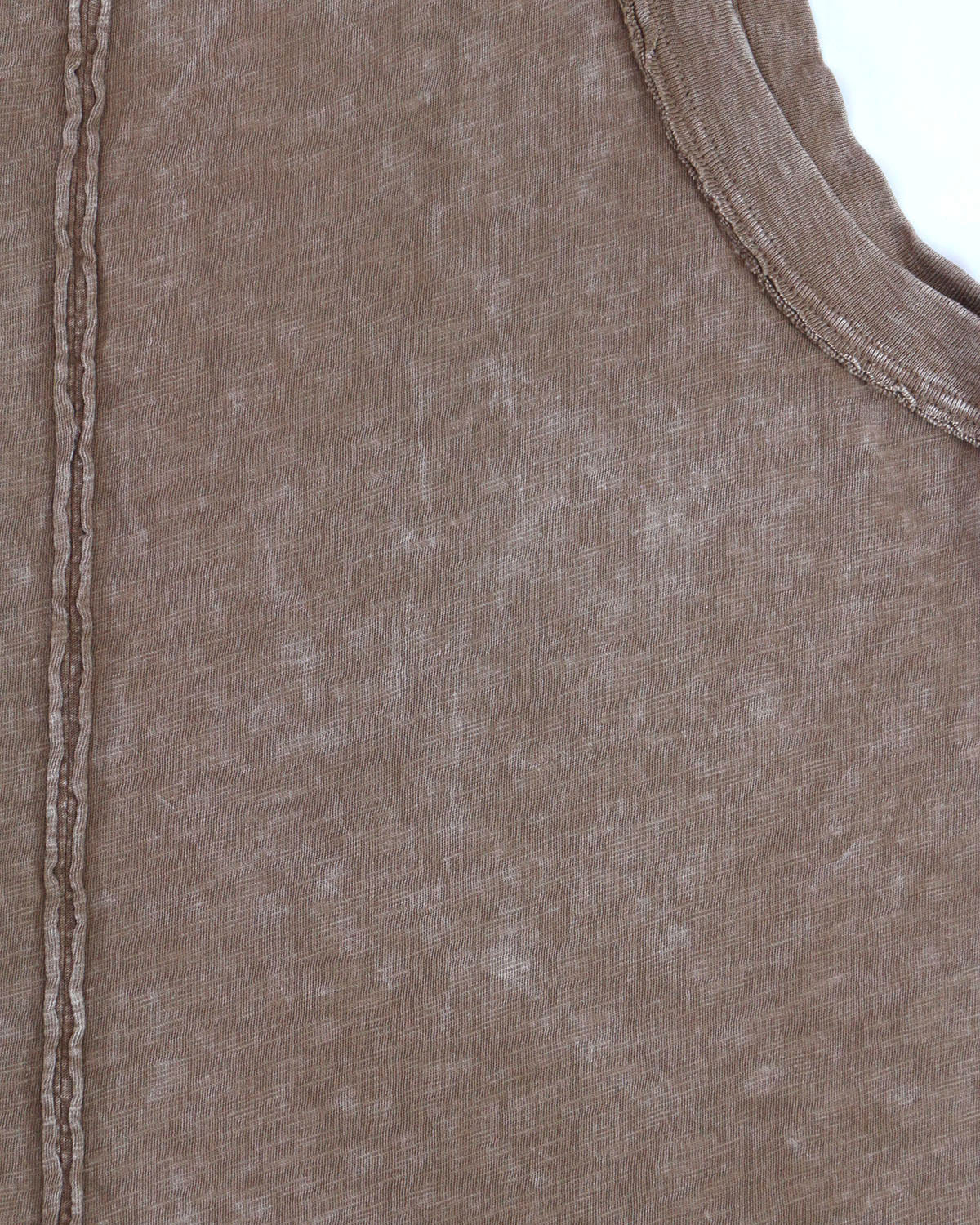 close up view of mineral washed fabric and distressed seams womens knit tank
