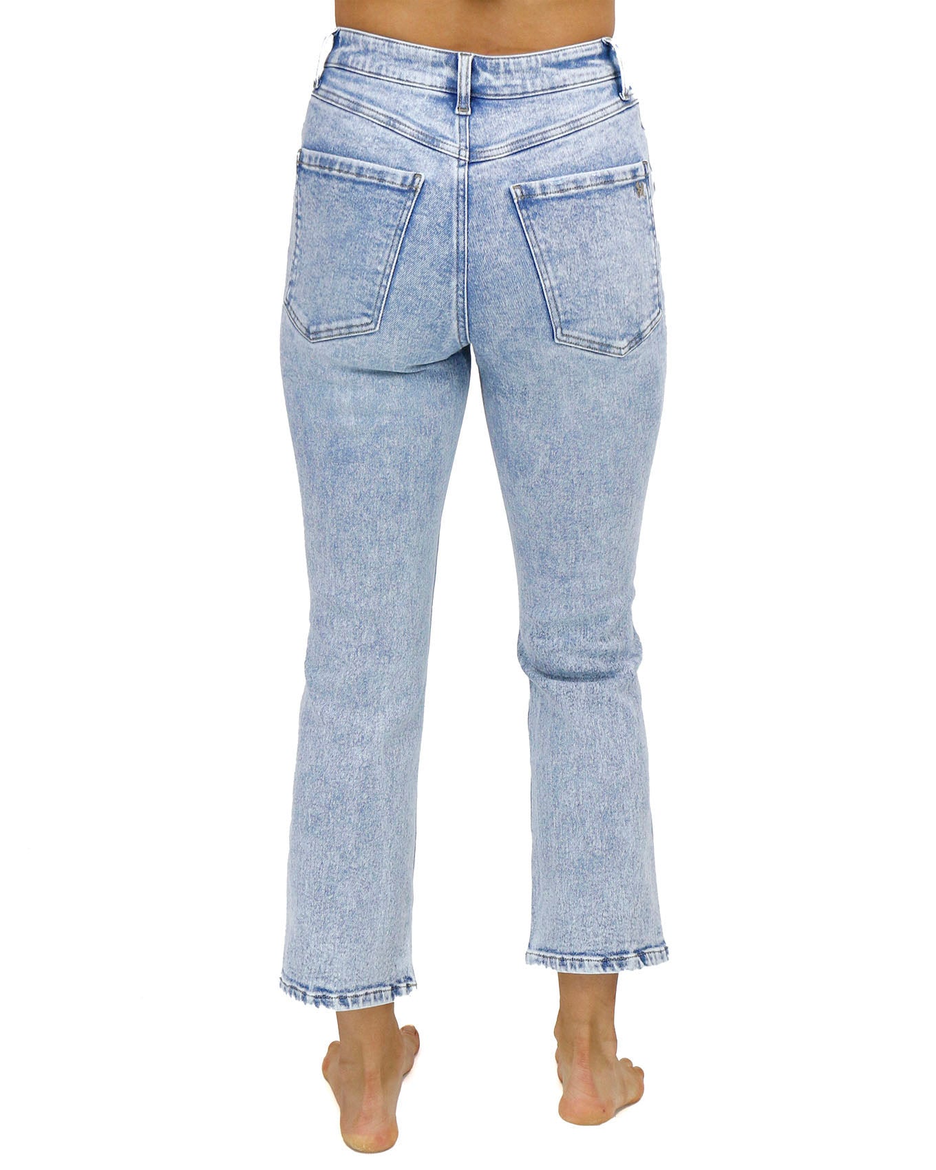 back view stock shot of premium high waisted mom jeans in distressed light mid-wash