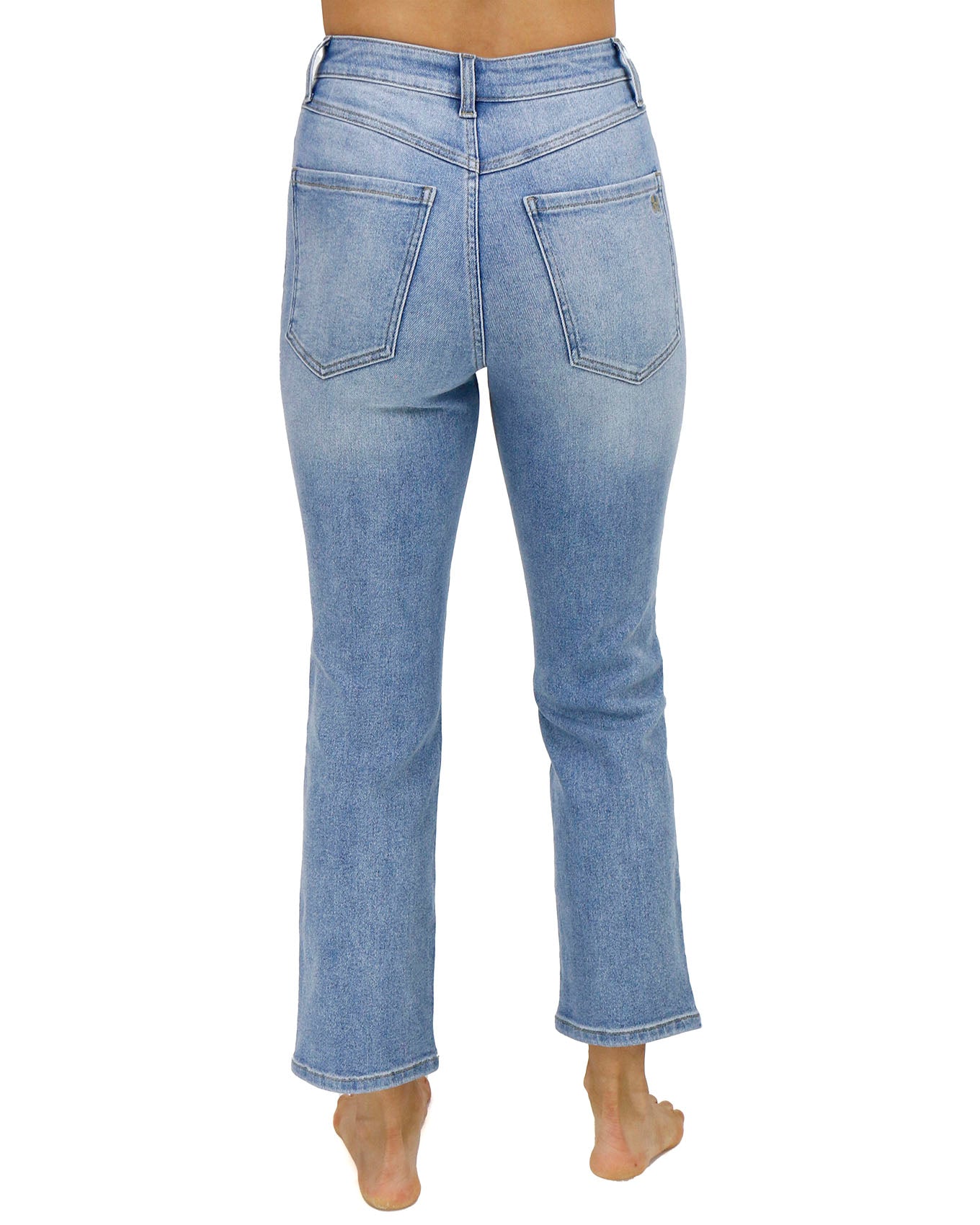 back view stock shot of premium high waisted mom jeans in non distressed mid-wash