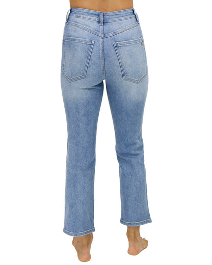 back view stock shot of premium high waisted mom jeans in non distressed mid-wash